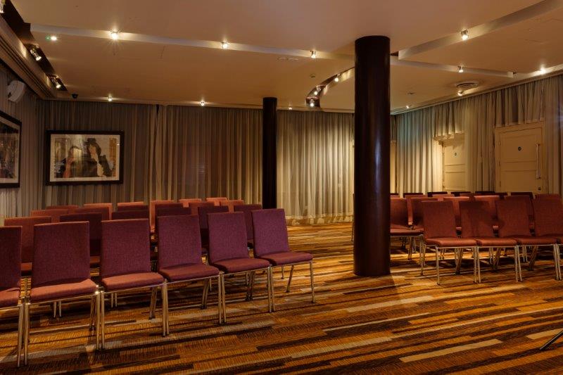 Zygmant Suite meeting space with chairs, ideal for professional events and presentations.