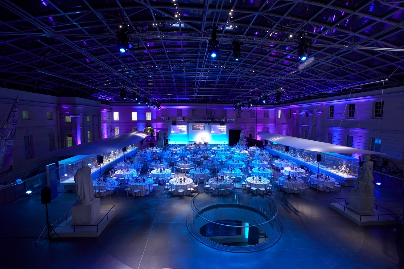 Elegant event space in National Maritime Museum with blue lighting for gatherings.