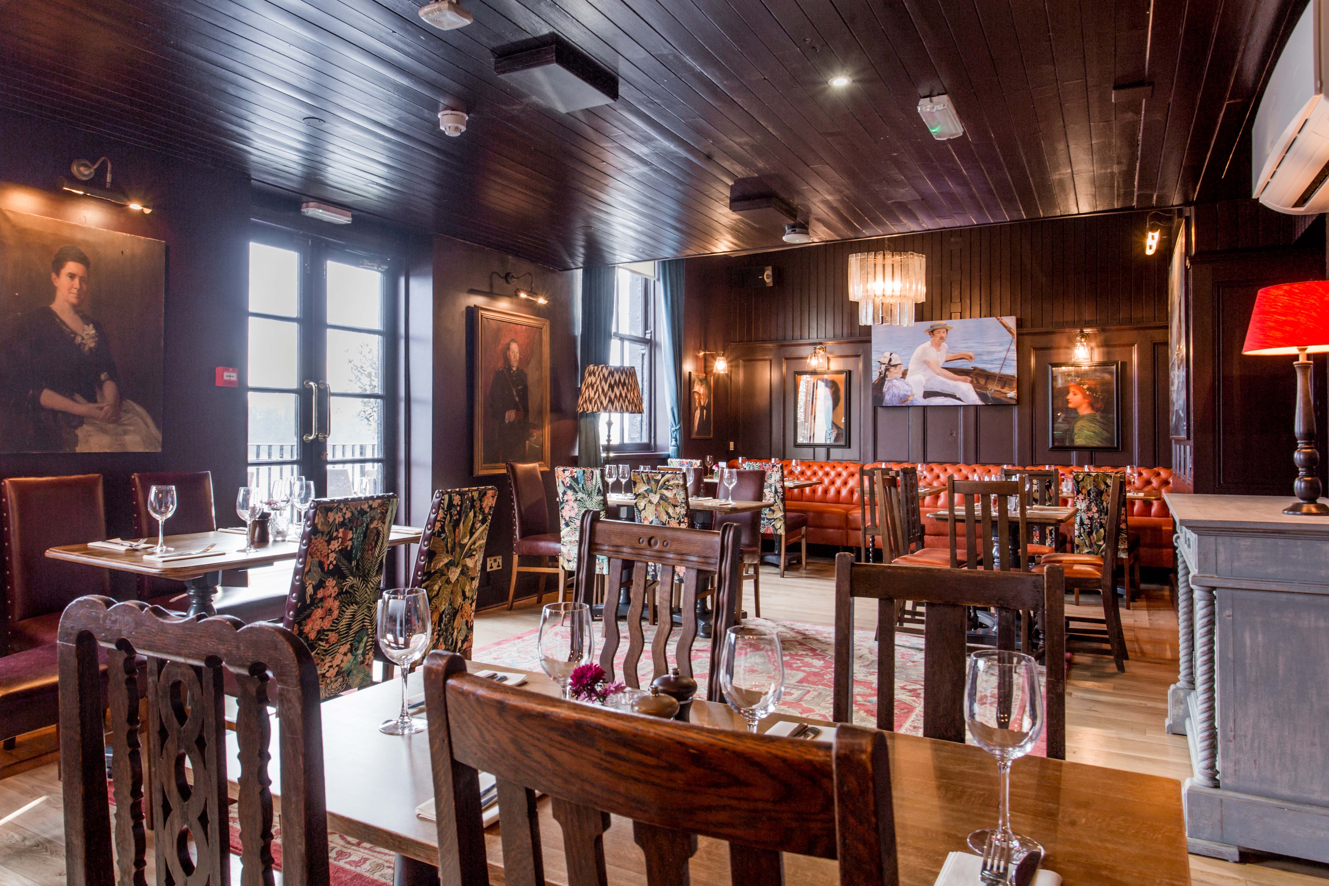 Elegant restaurant interior with dark wood, perfect for intimate gatherings and events.