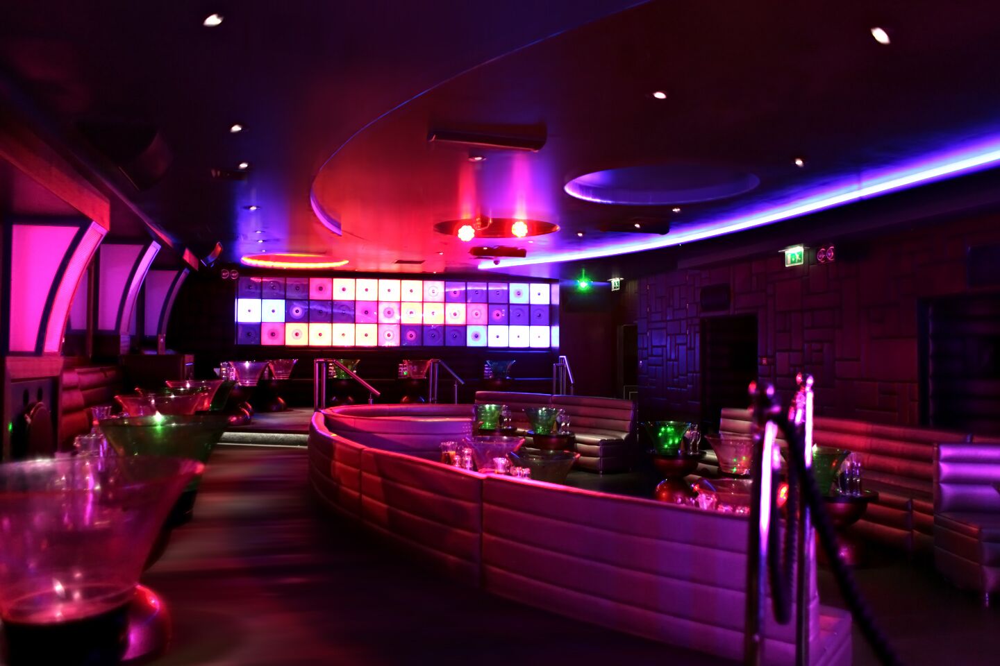 Vibrant Maddox Club Mayfair main room with sleek bar, ideal for upscale events and parties.