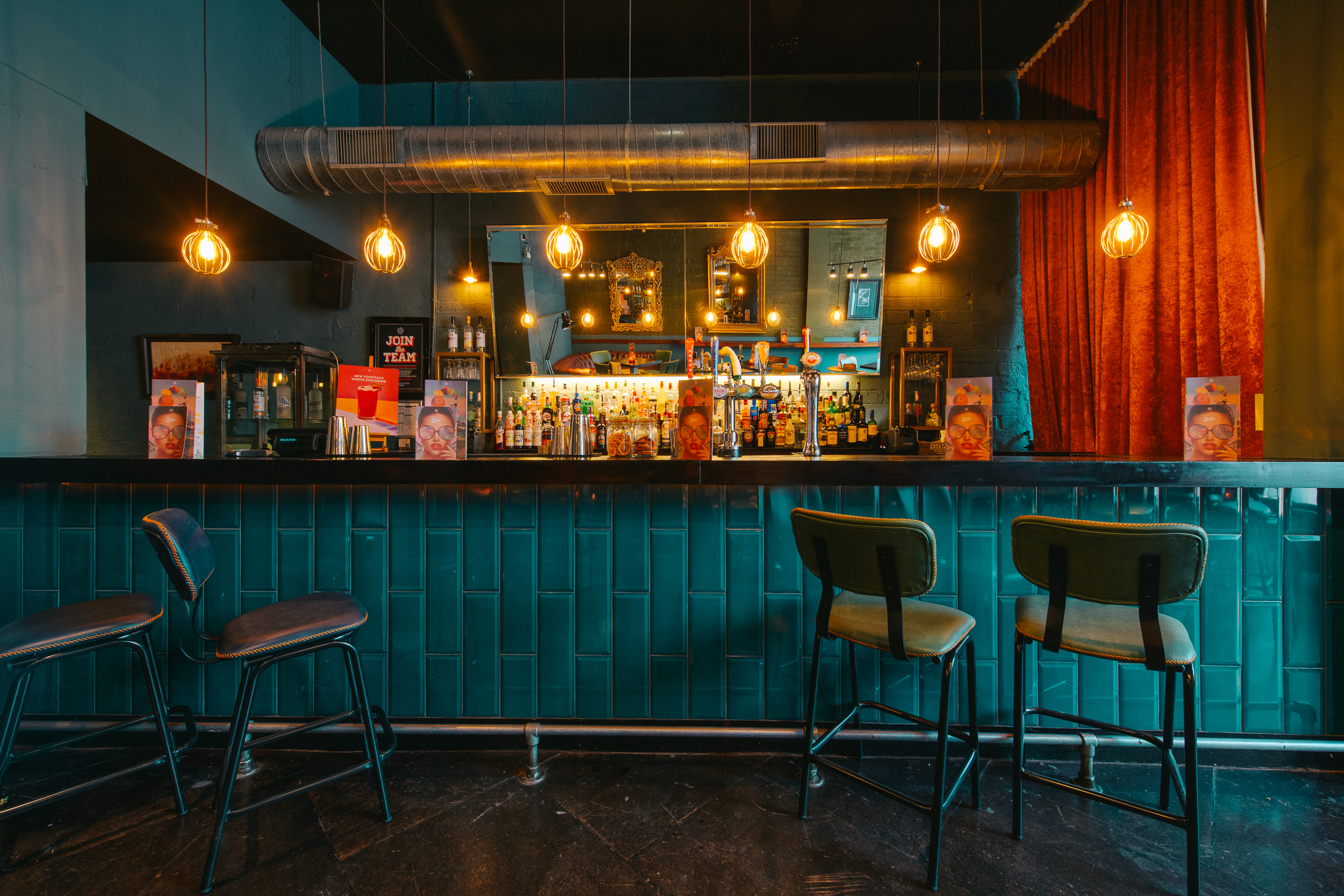 Stylish bar area in Hidden Bar, Revolution Sheffield for networking events and gatherings.