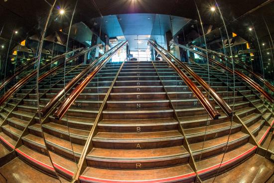 "Upscale Hidden Bar staircase in Revolution Sheffield, ideal for events and networking."