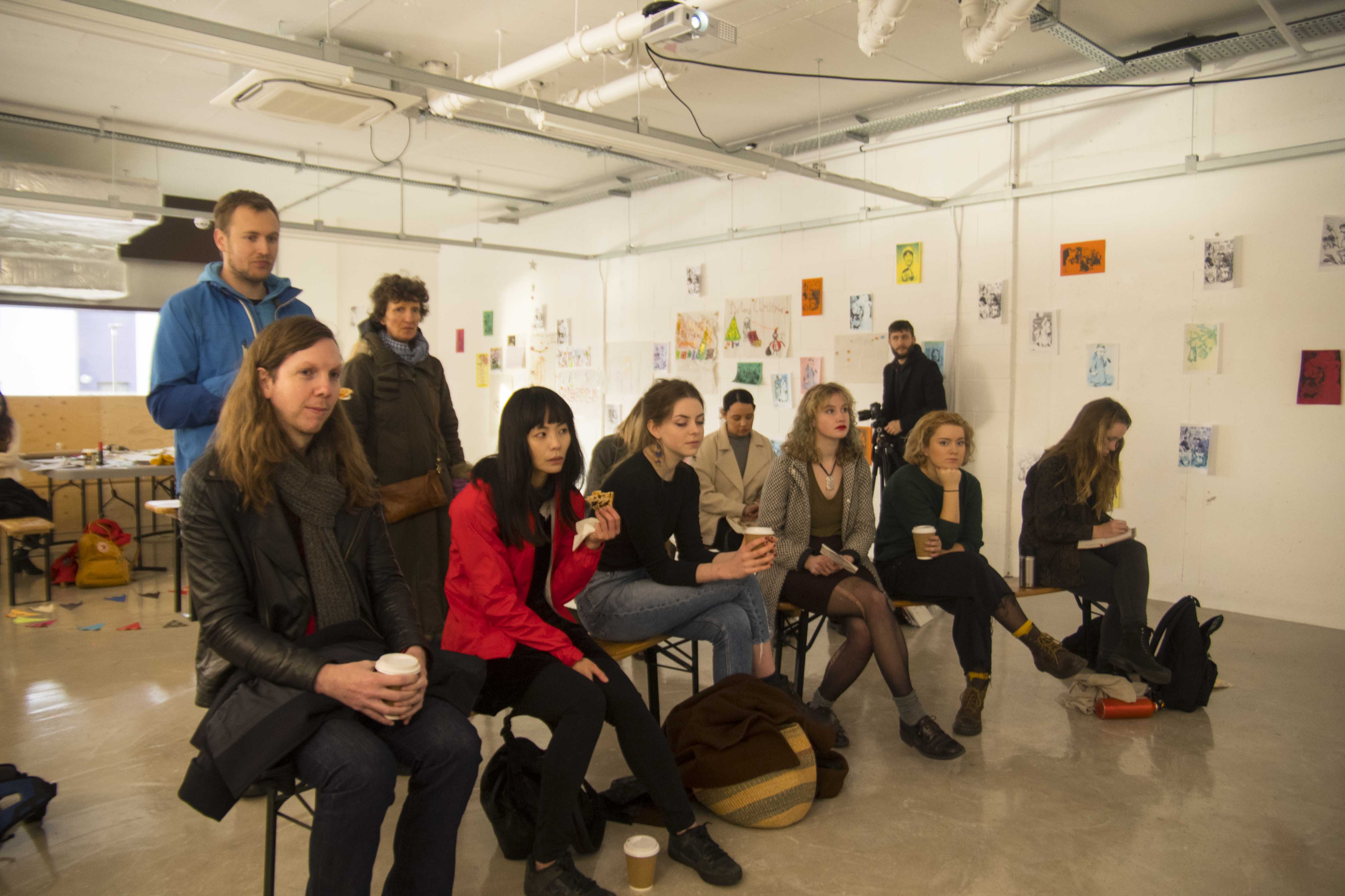Diverse attendees in a creative workshop on Mezanine Floor at R.A.W Labs.