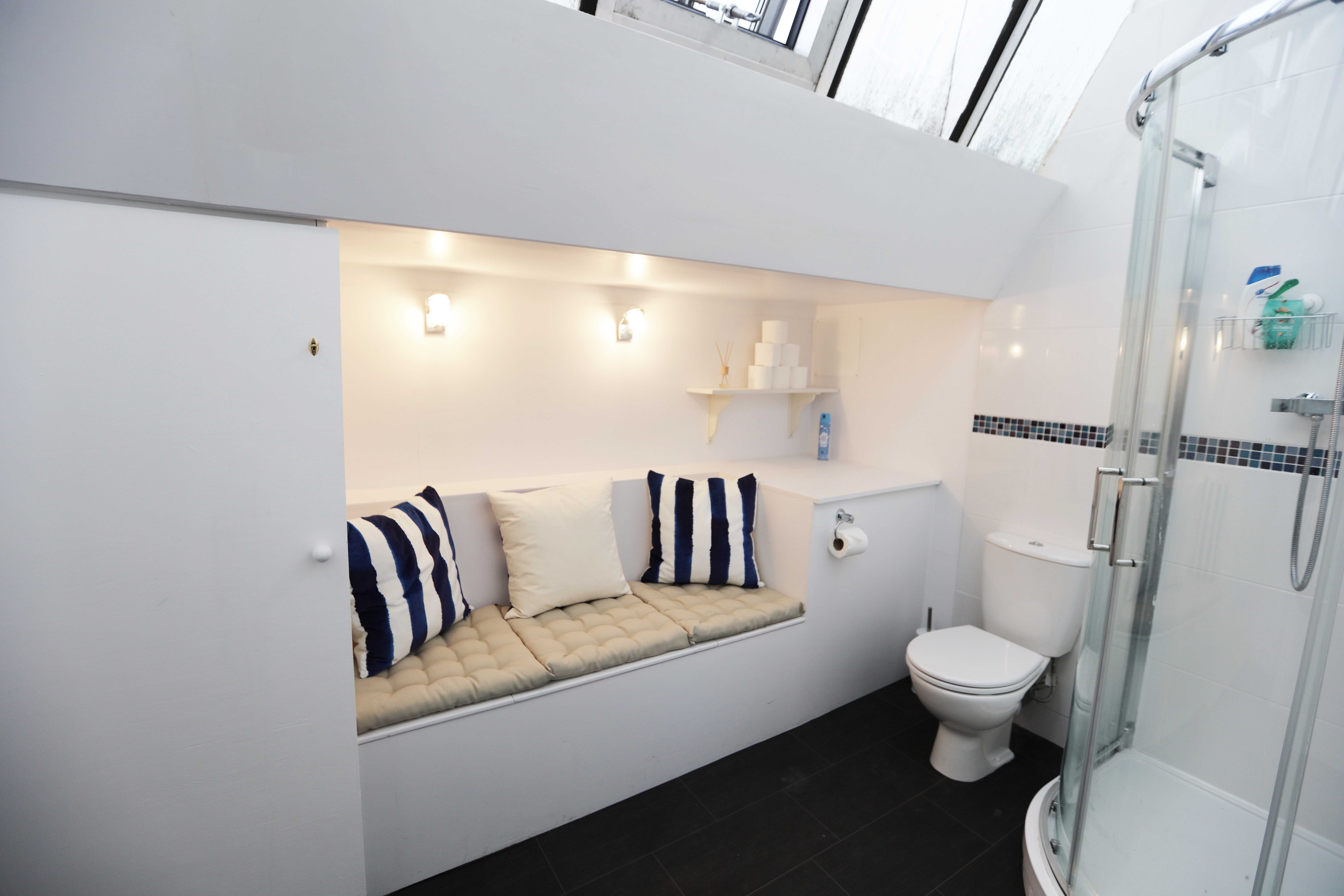 Modern restroom with cozy seating at North 17 Studios event venue.