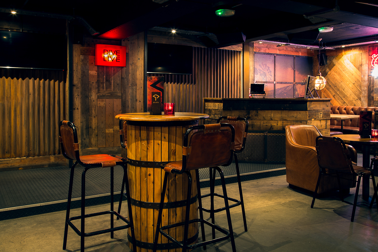 Stylish event room with rustic decor, ideal for casual networking and small gatherings.