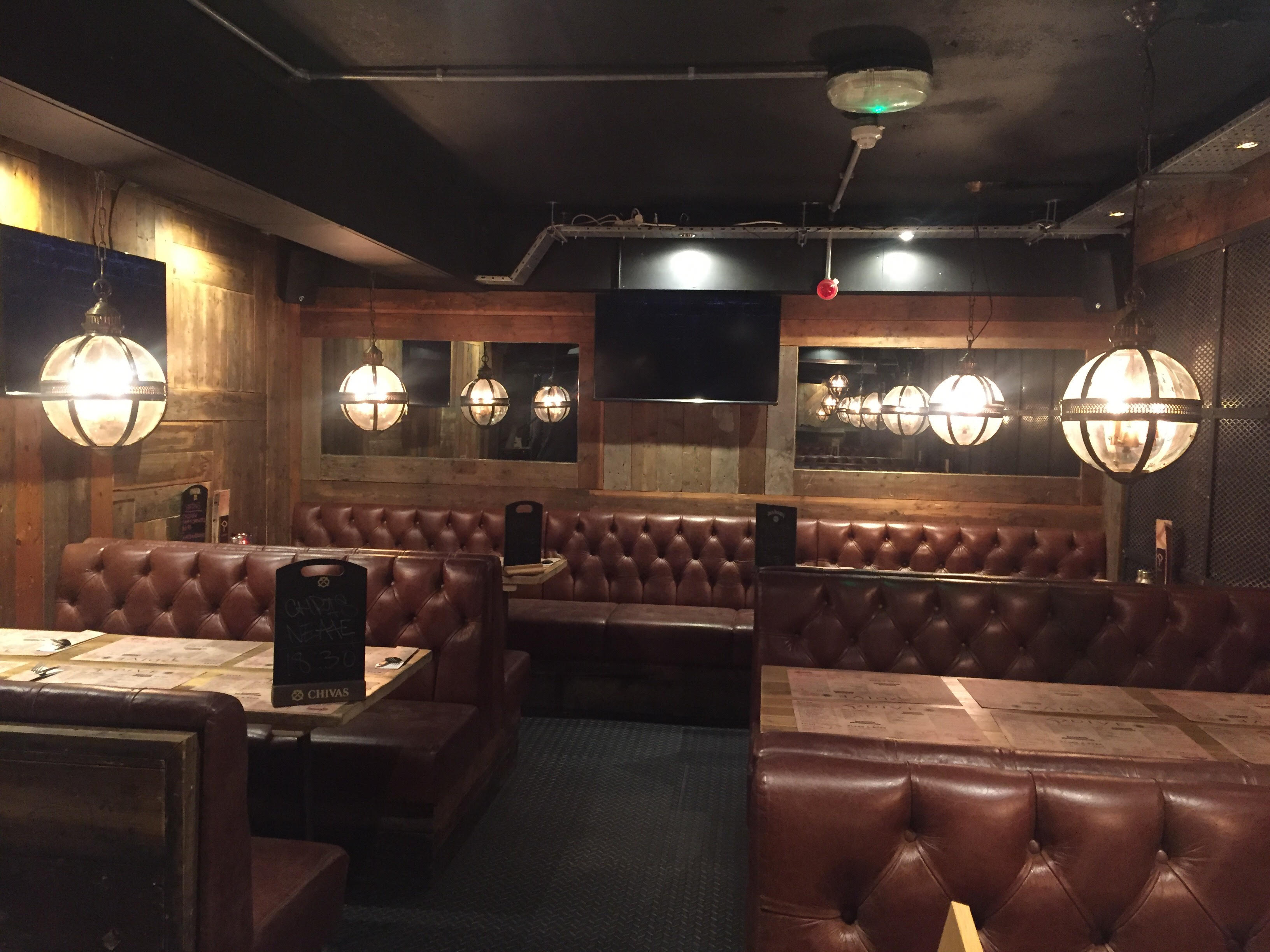 Stylish intimate restaurant venue with warm lighting for private events and meetings.