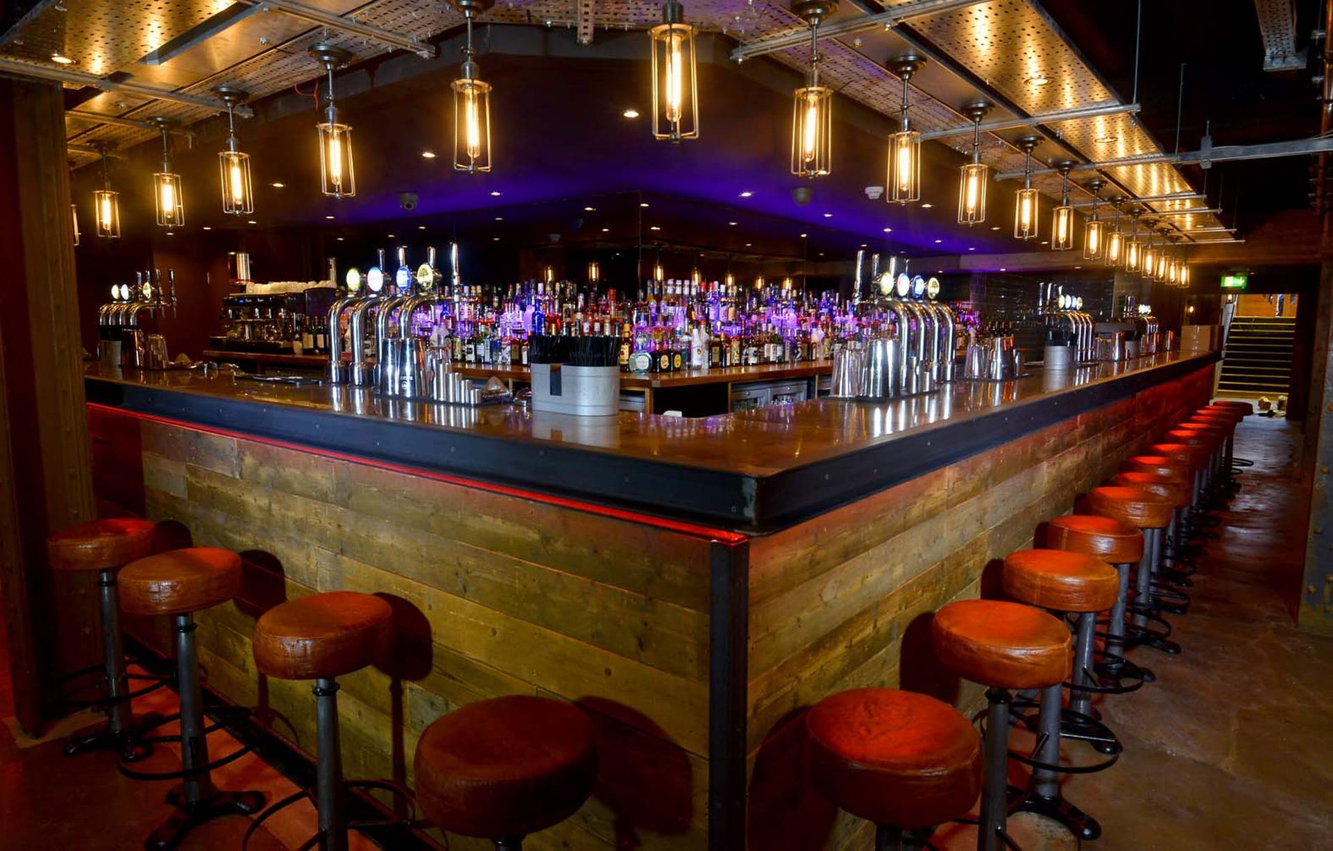 Stylish bar at Dive NQ, perfect for networking events and social gatherings.