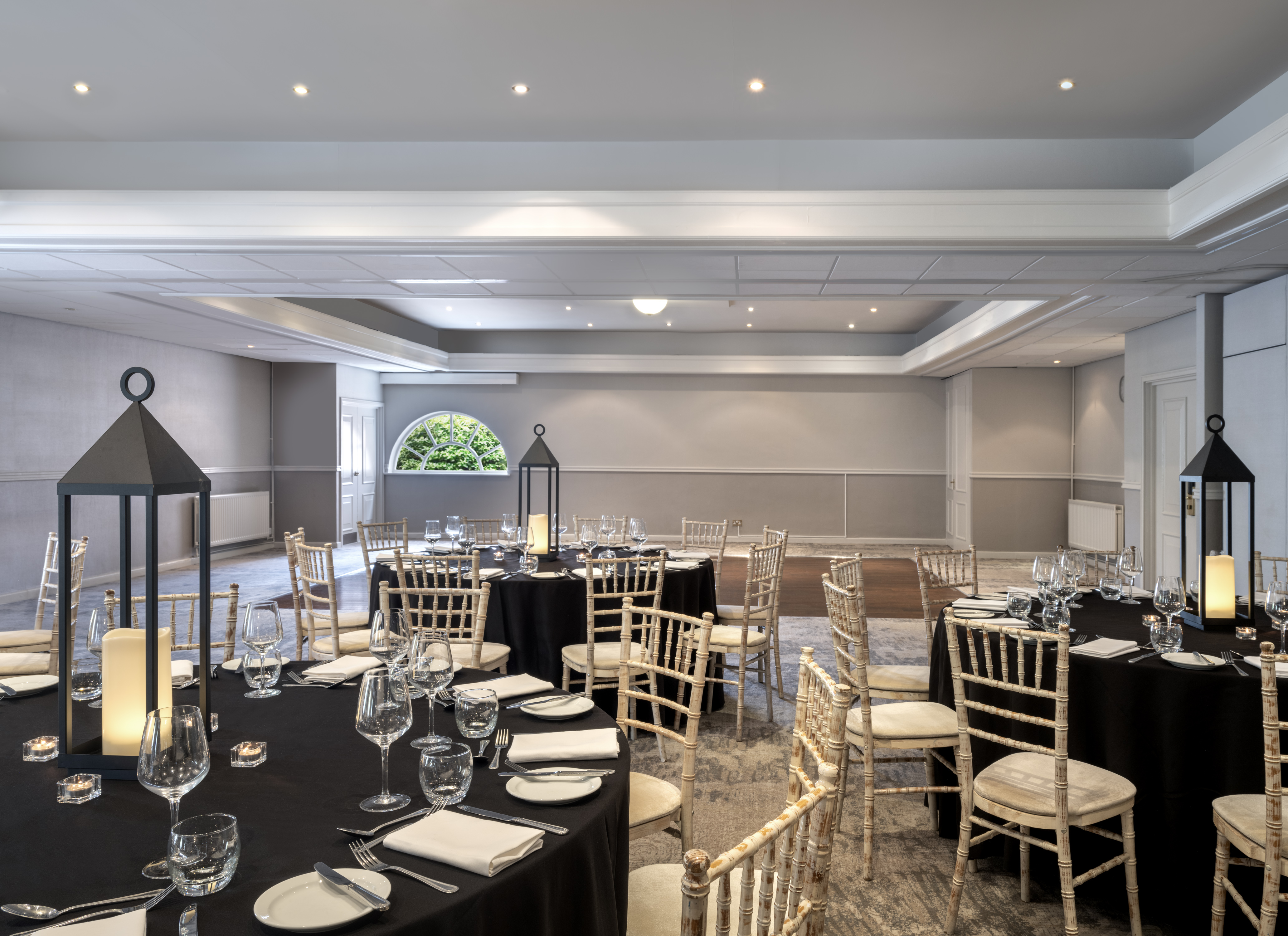 Elegant Thurnham Suite with black linens, perfect for corporate events and gatherings.