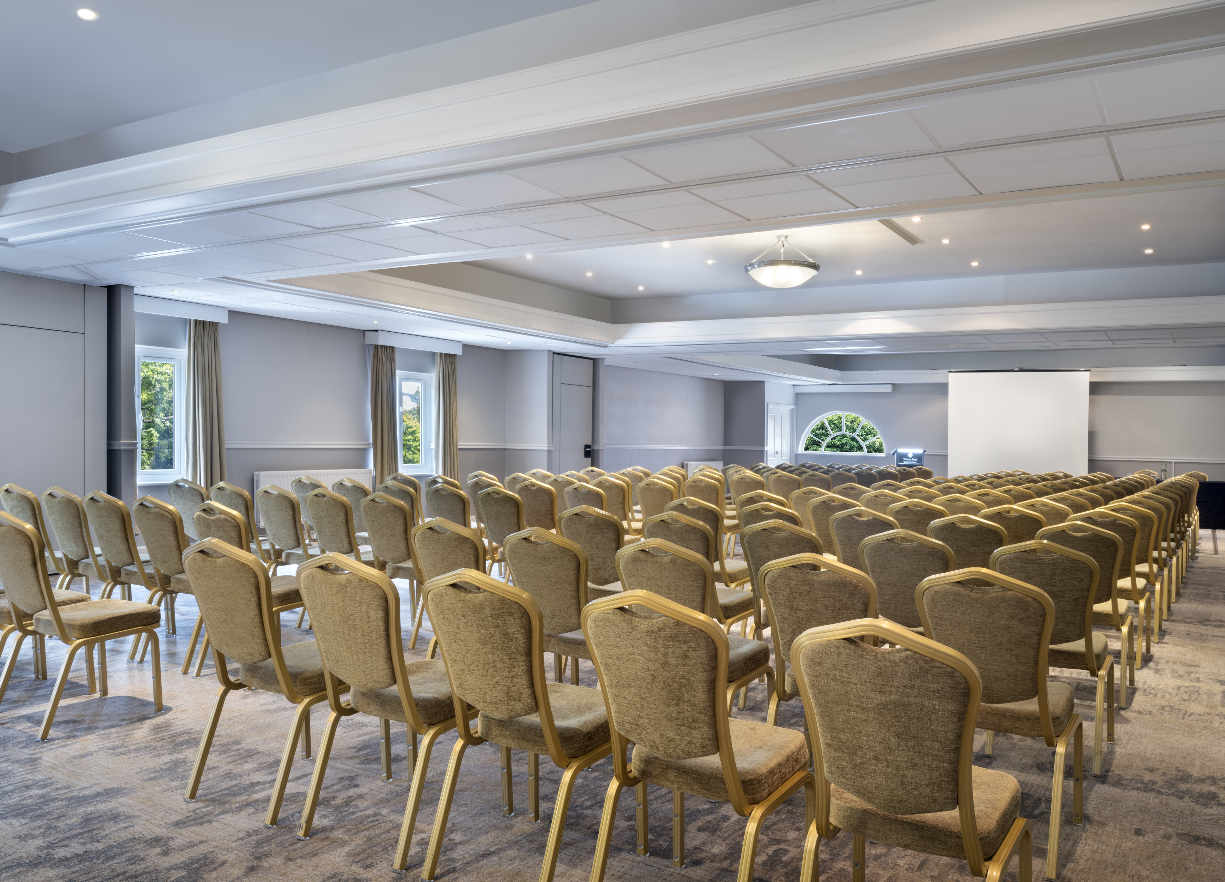 Thurnham Suite conference room with gold chairs, ideal for events and workshops.