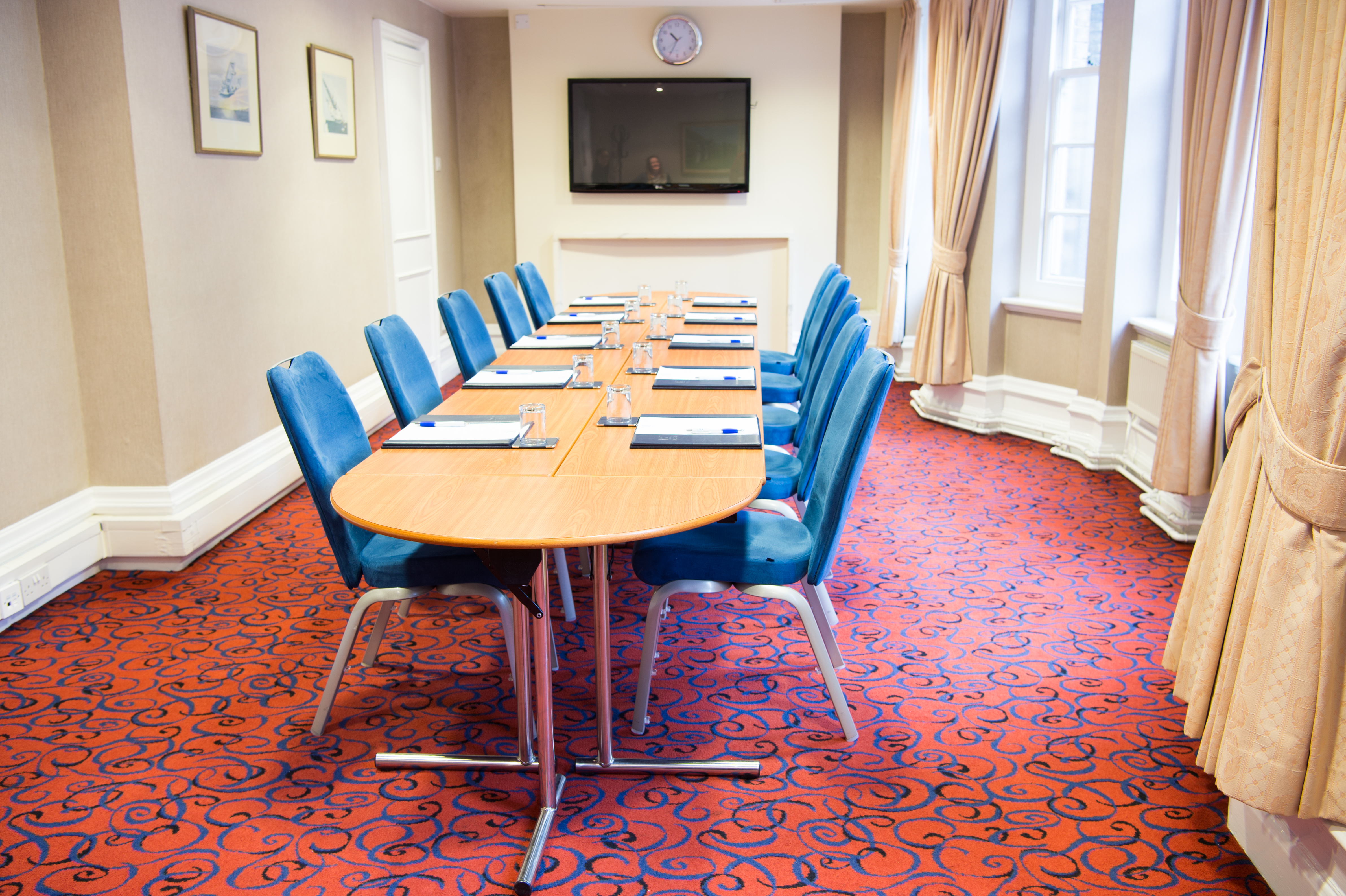 Committee Room at Victory Services Club with oval table, ideal for professional meetings.