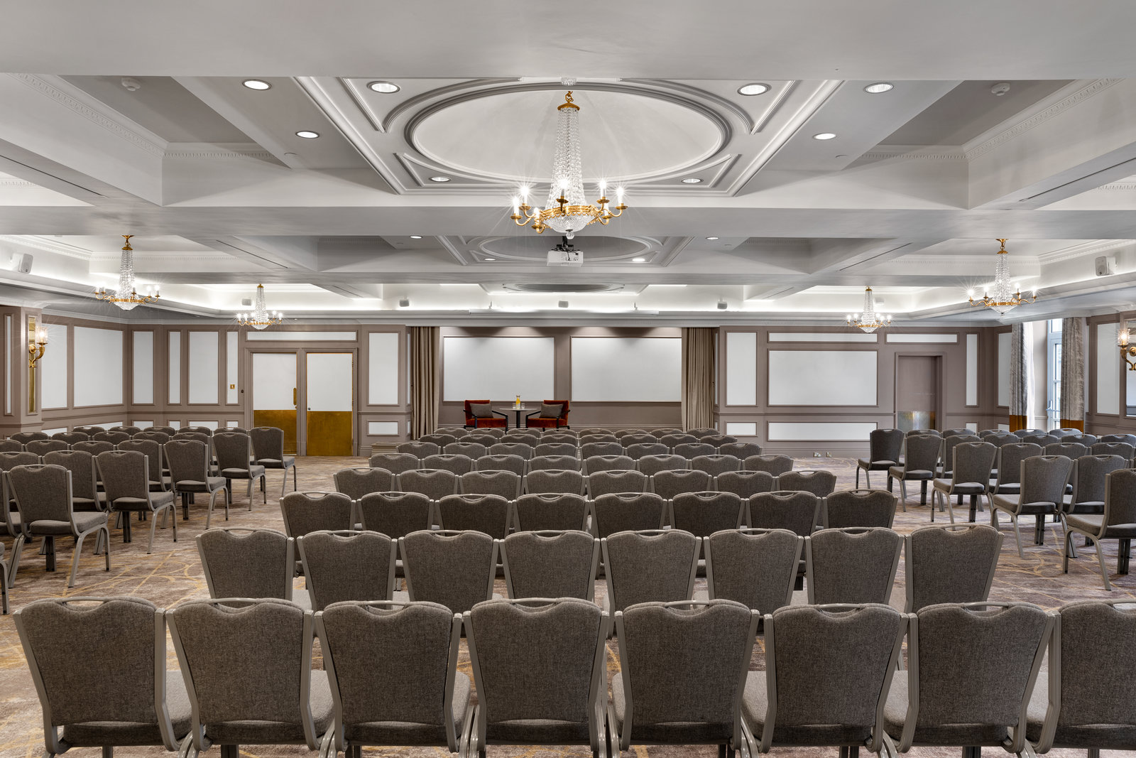 Kings Suite ballroom featuring coffered ceilings for corporate conferences and theater-style events.