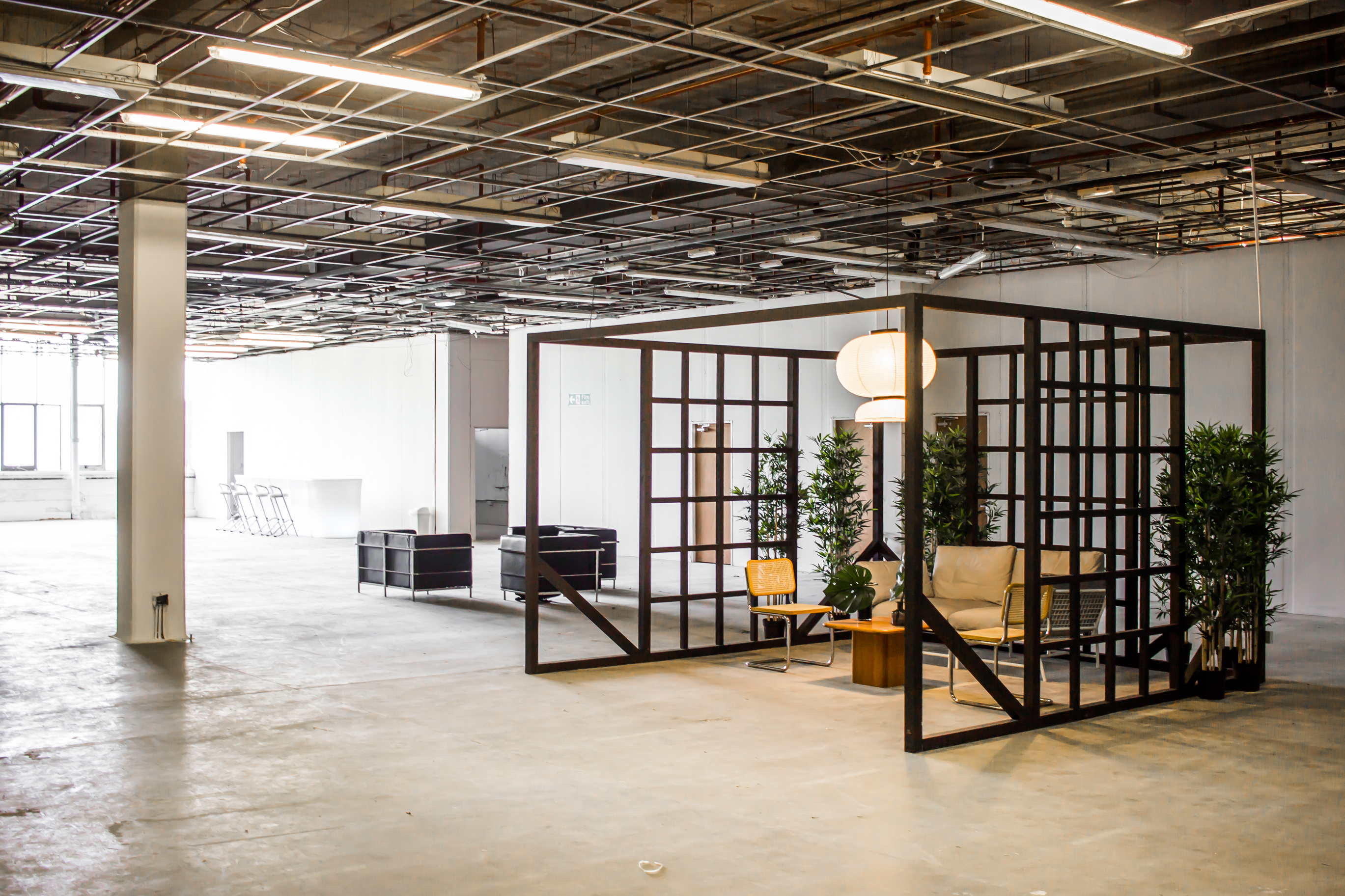 Versatile Main Gallery event space with natural light for workshops and social gatherings.