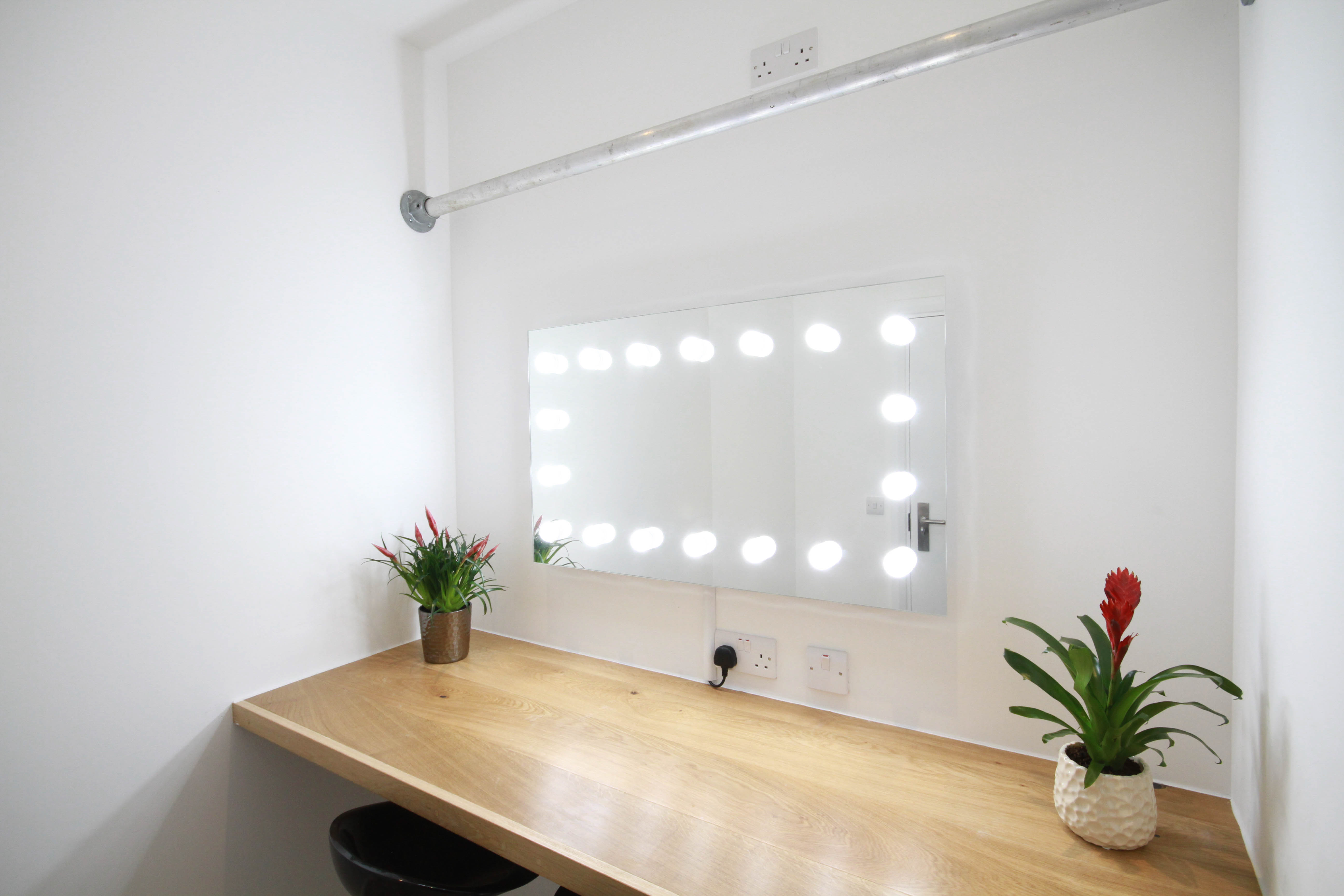 Dressing room with wooden vanity and LED lights for events at FWstudios.