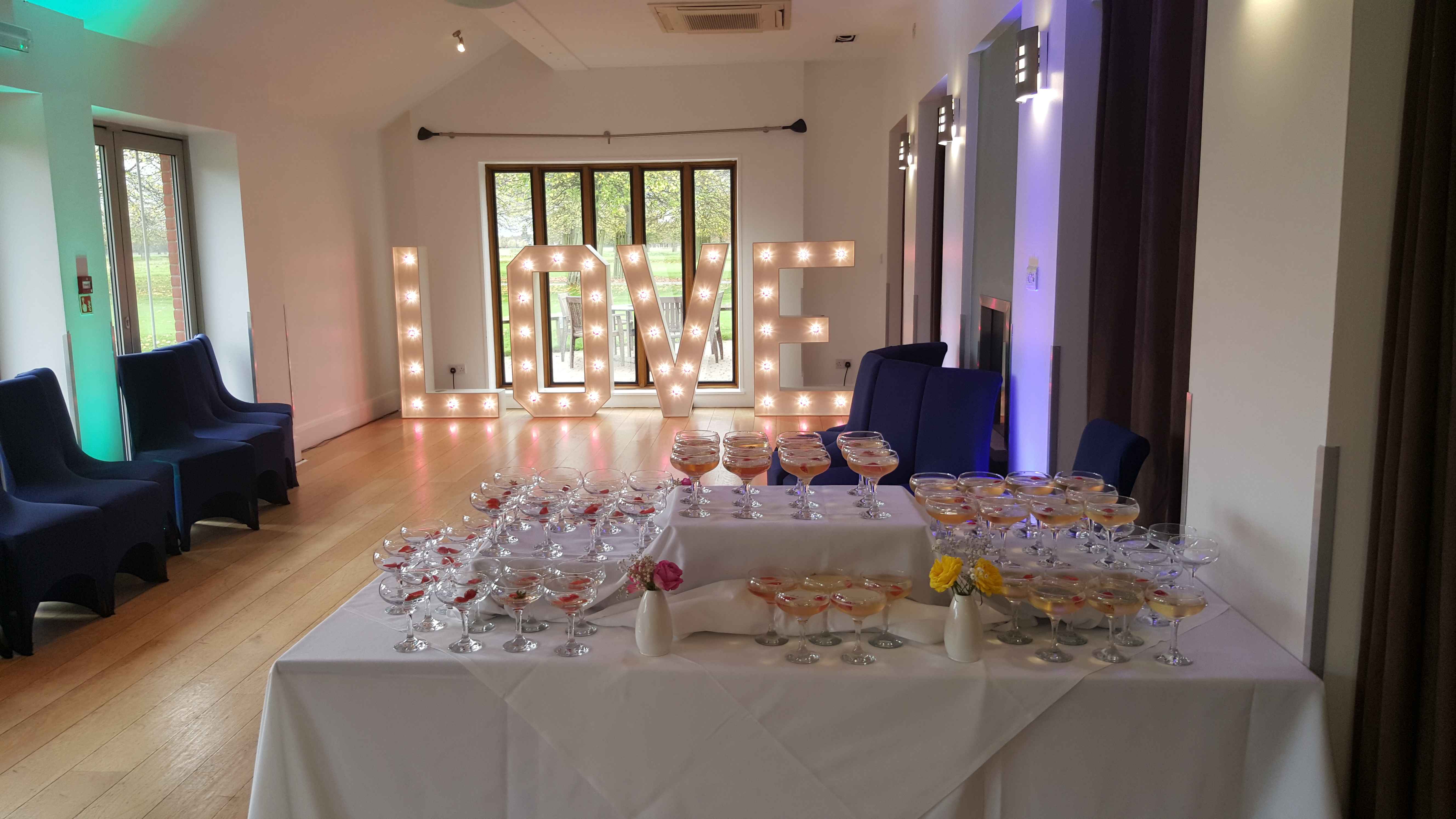Terrace Suite at Hampton Court Palace Golf Club with romantic "LOVE" sign for weddings.