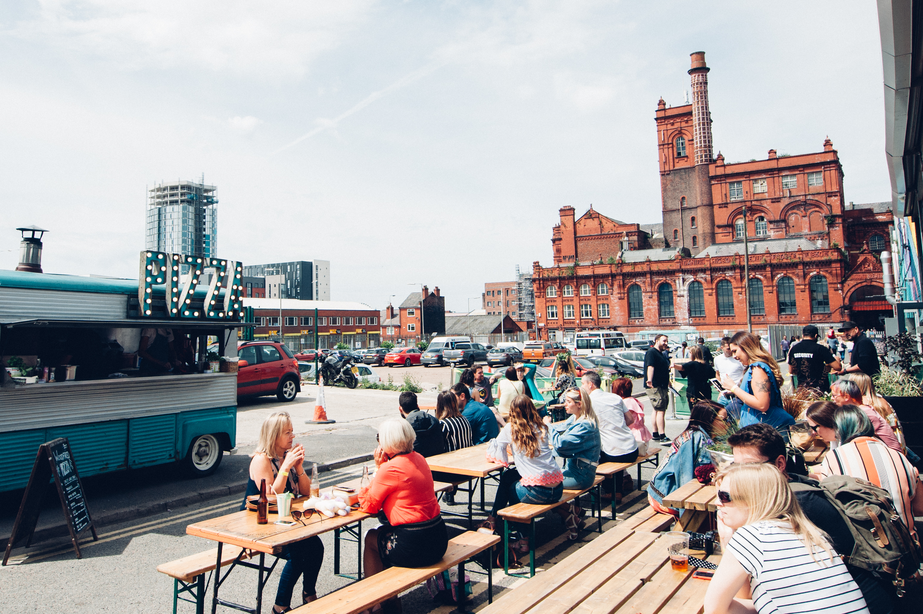 Vibrant outdoor event space with food truck, ideal for summer gatherings and networking.