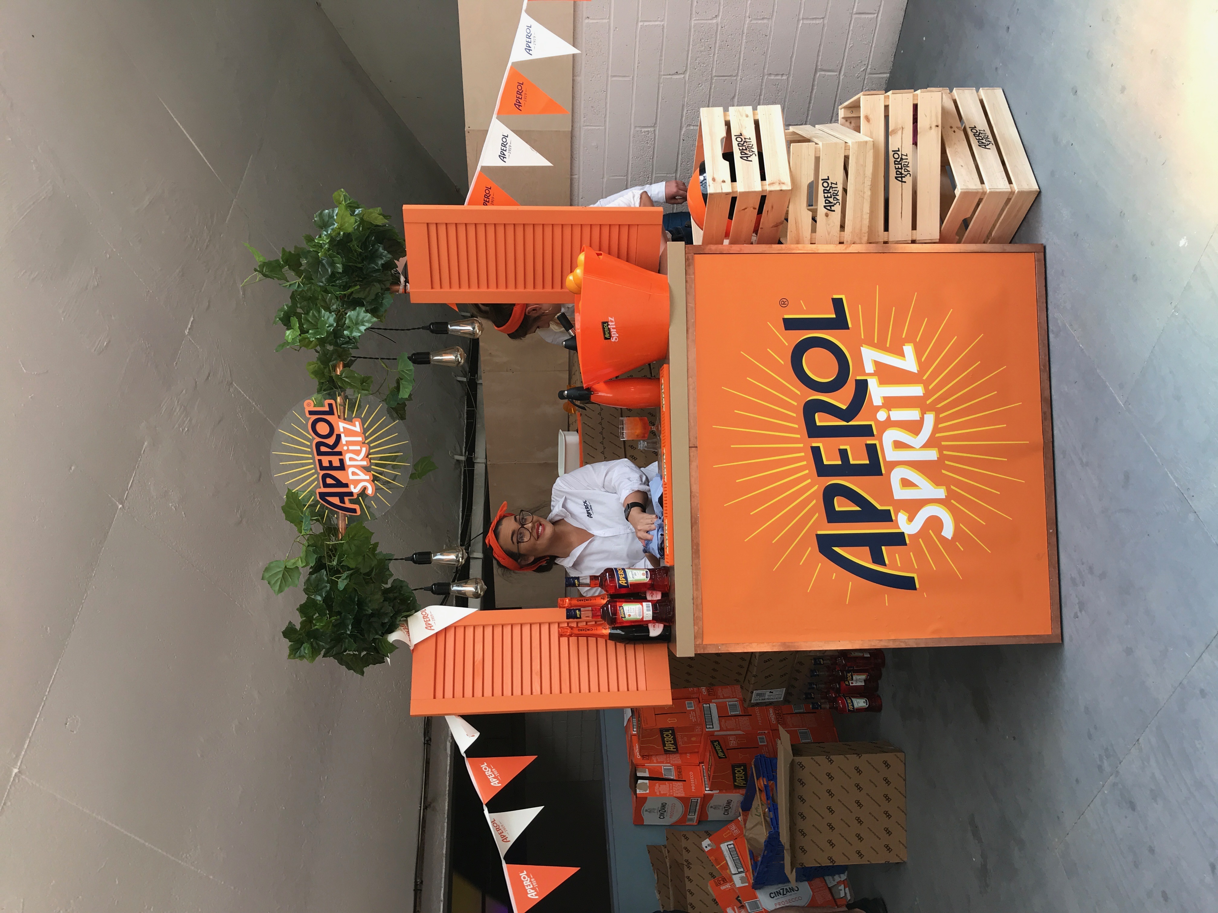 Vibrant Aperol Spritz bar at Hinterlands for networking and celebration events.