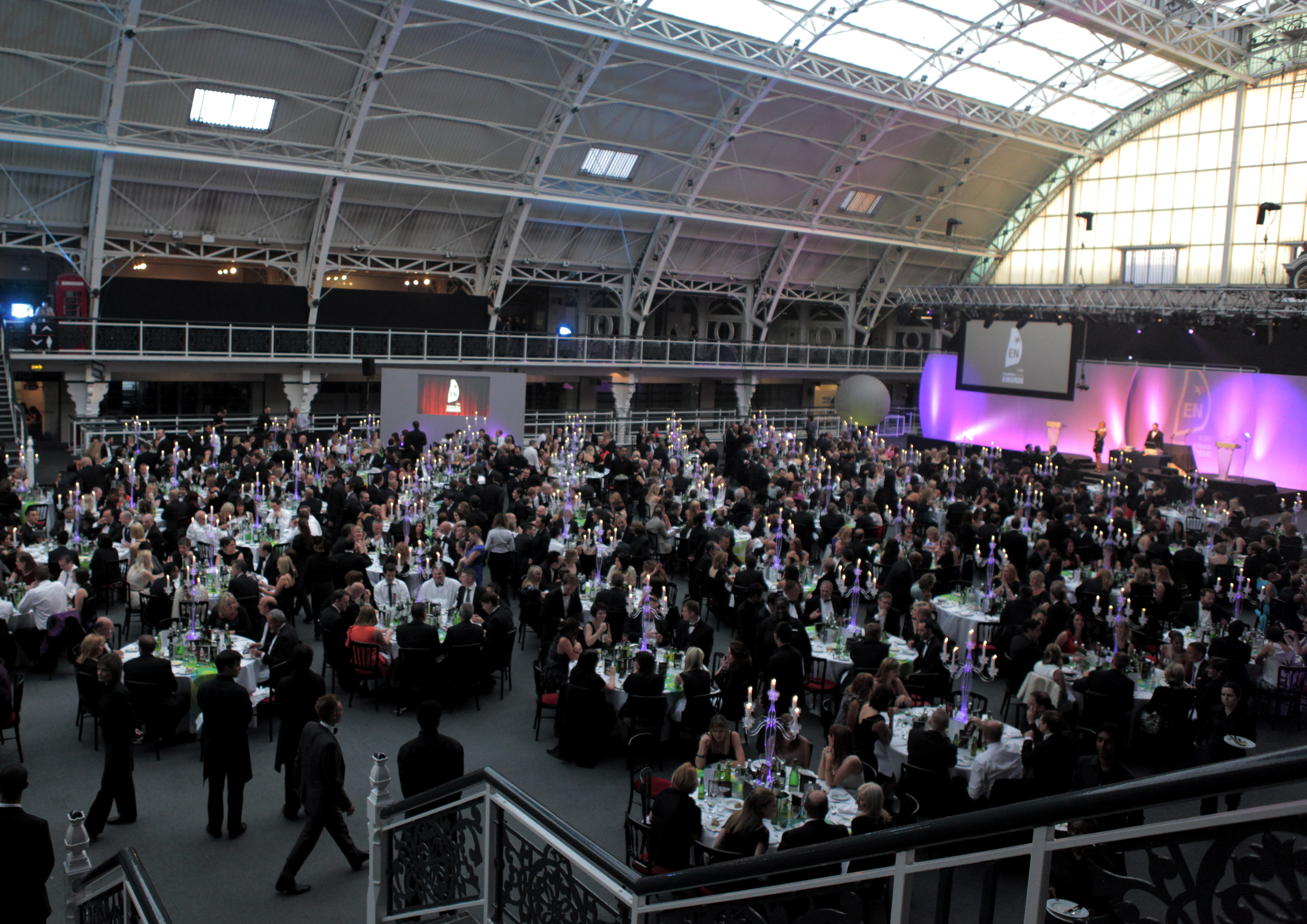 Large event at Business Design Centre with elegant tables and sophisticated lighting.