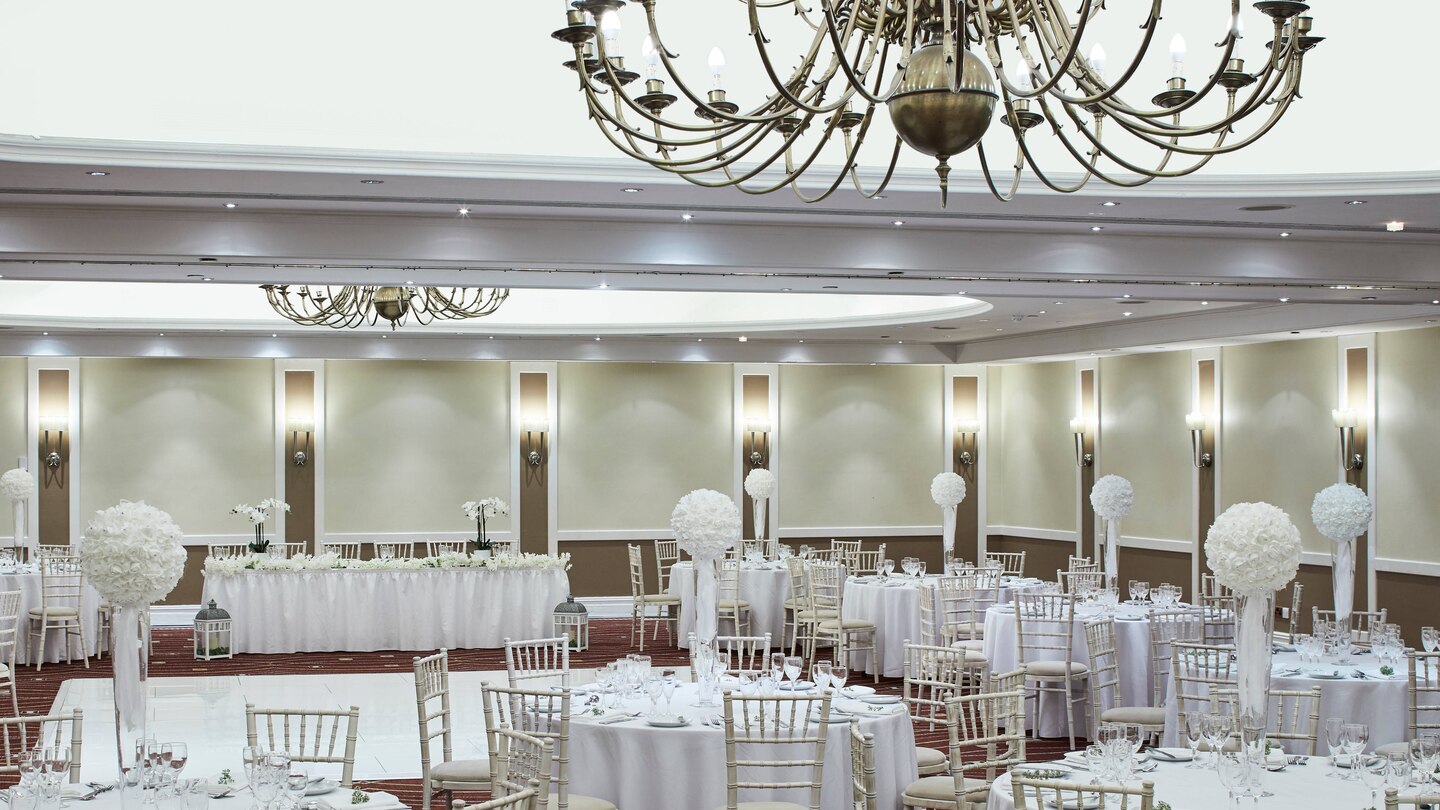 Mary Rose Suite at Portsmouth Marriott, elegant wedding venue with chandeliers and floral decor.