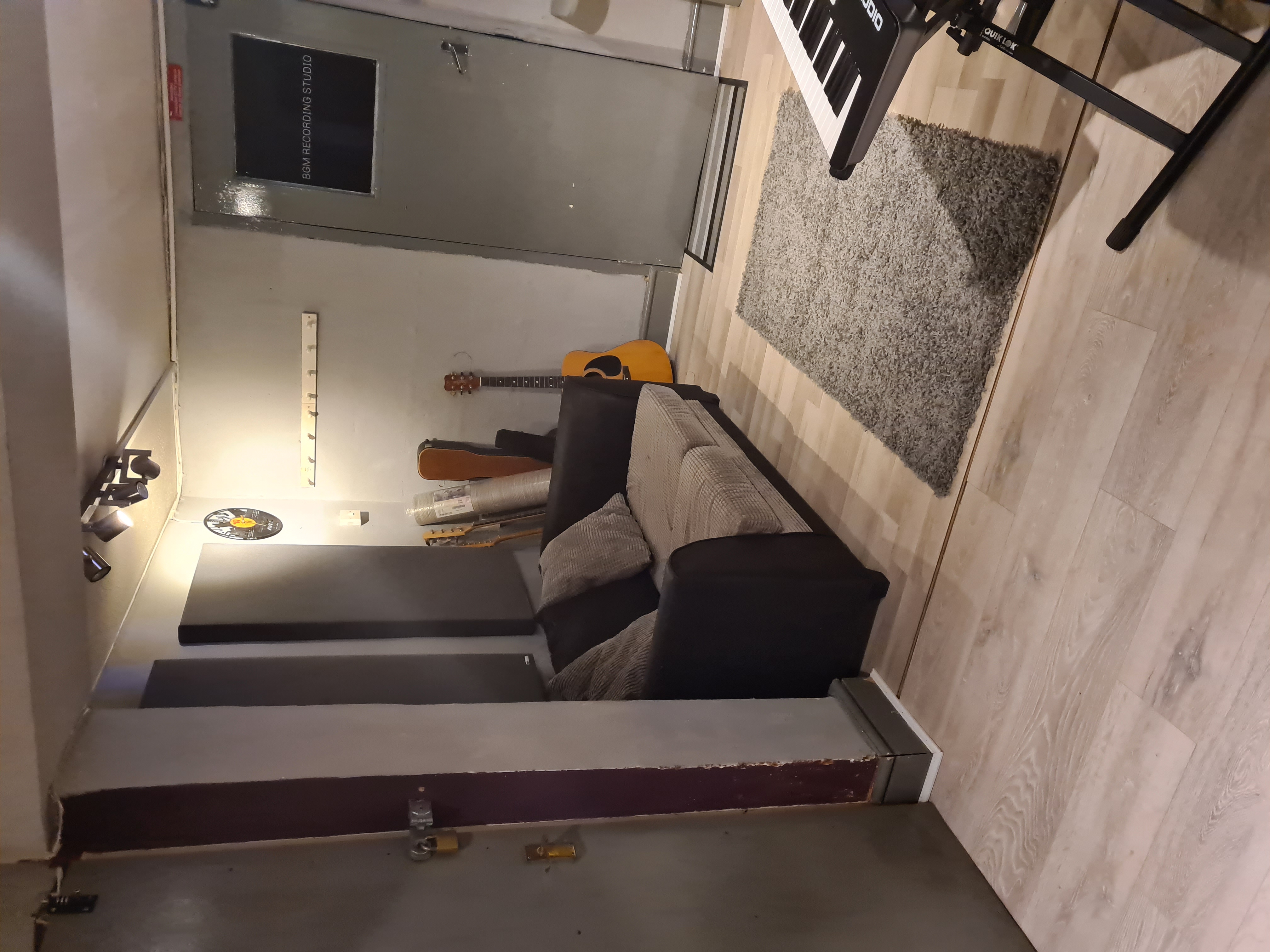 Cozy recording studio with instruments, perfect for creative brainstorming sessions.