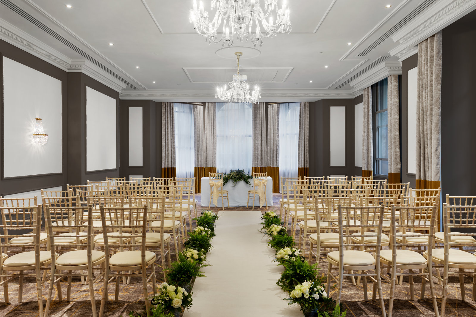Lancaster Suite wedding ballroom with white aisle runner, luxury event venue, Bristol ceremony.