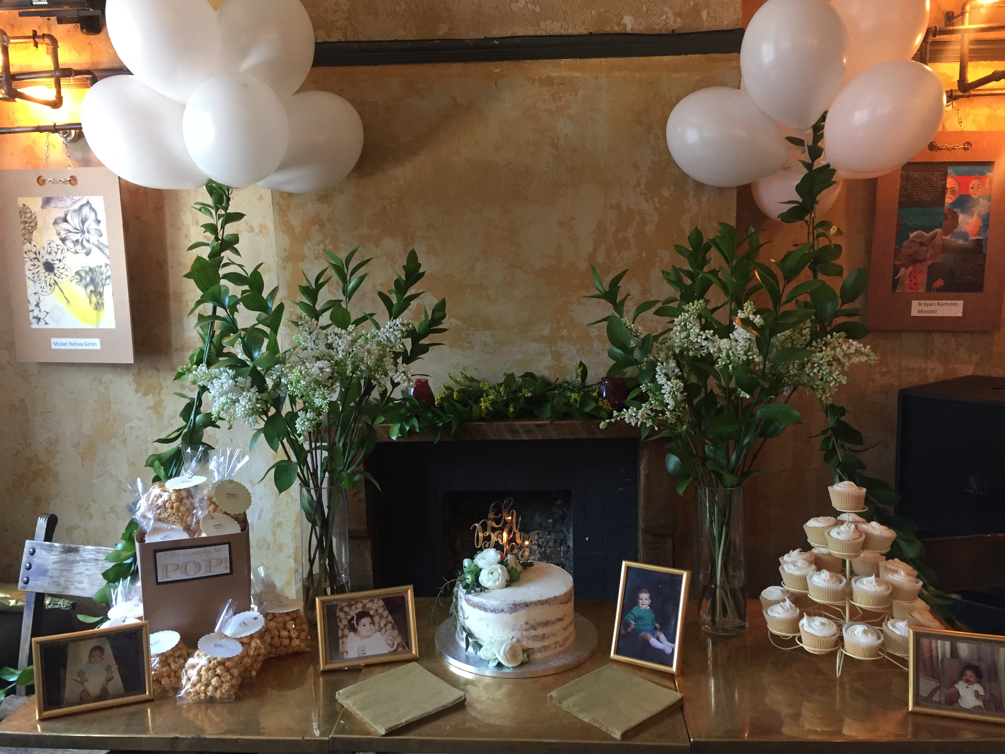 Music room event display with cake, cupcakes, and floral arrangements for celebrations.