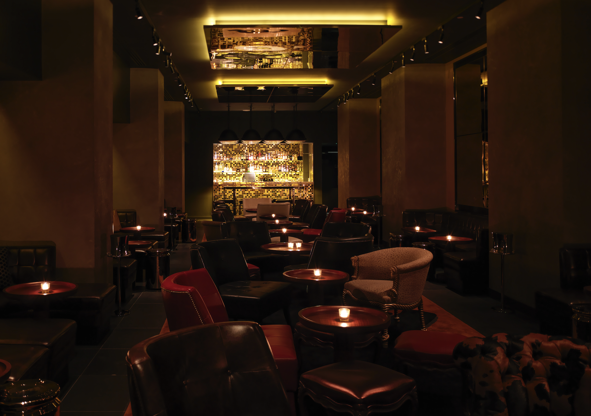 Sophisticated lounge at Blind Spot, warm lighting for intimate gatherings and networking events.