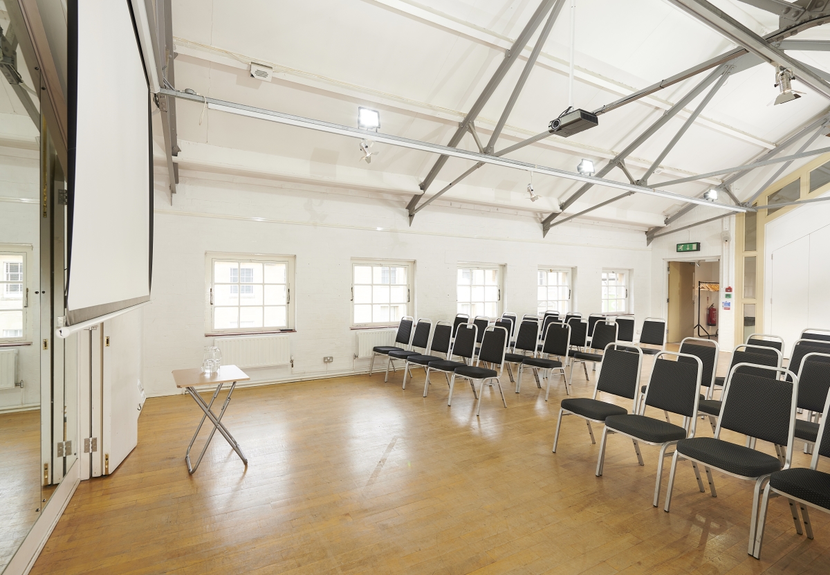 Versatile meeting space at Oxford Playhouse with natural light for seminars and workshops.