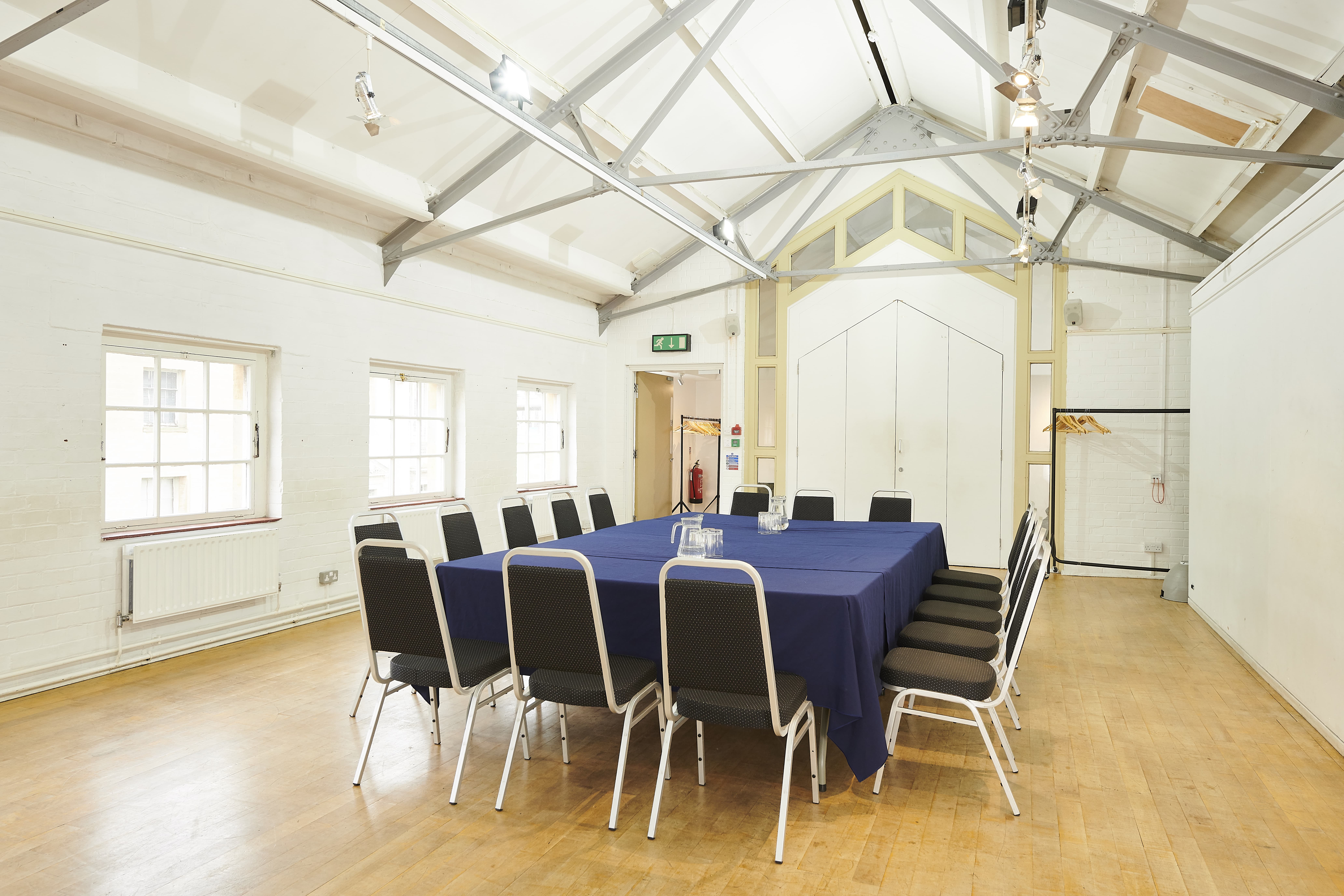 Well-lit meeting room with large table at Oxford Playhouse, ideal for events and discussions.