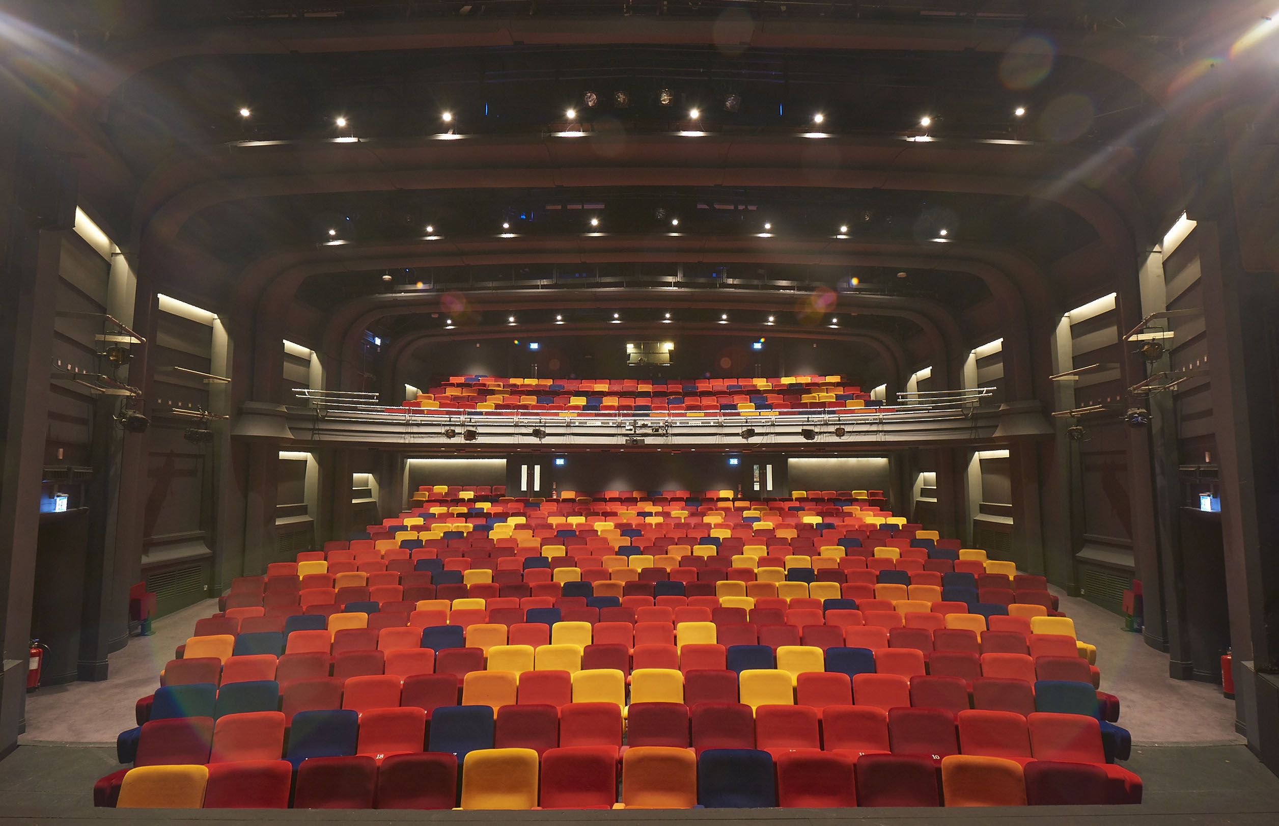Main Stage Auditorium at Oxford Playhouse with vibrant tiered seating for events.