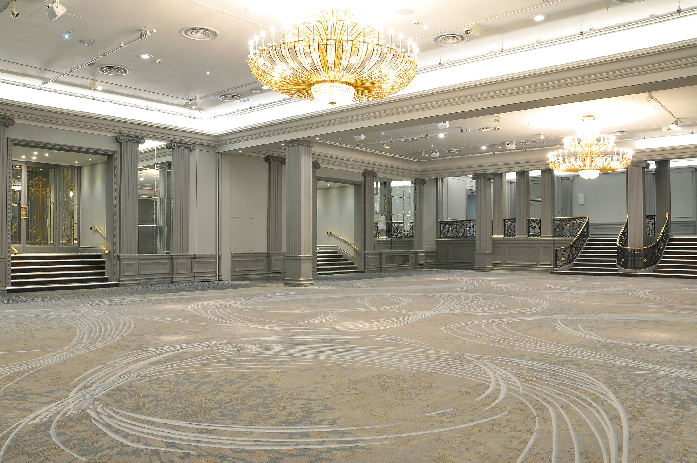 Elegant ballroom with chandeliers at JW Marriott Grosvenor House for conferences and events.
