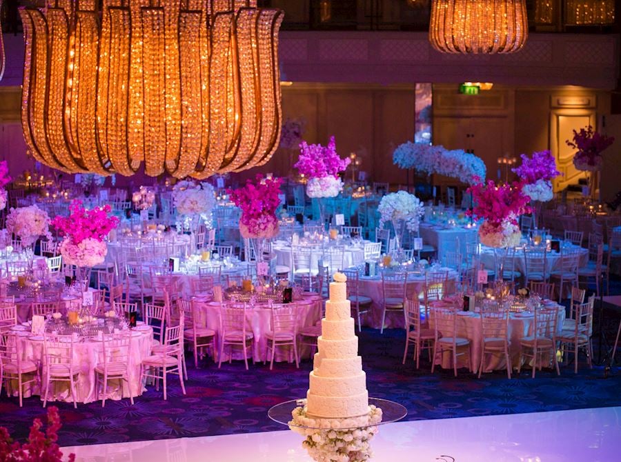 JW Marriott Grosvenor House ballroom with elegant tables and floral centerpieces for weddings.