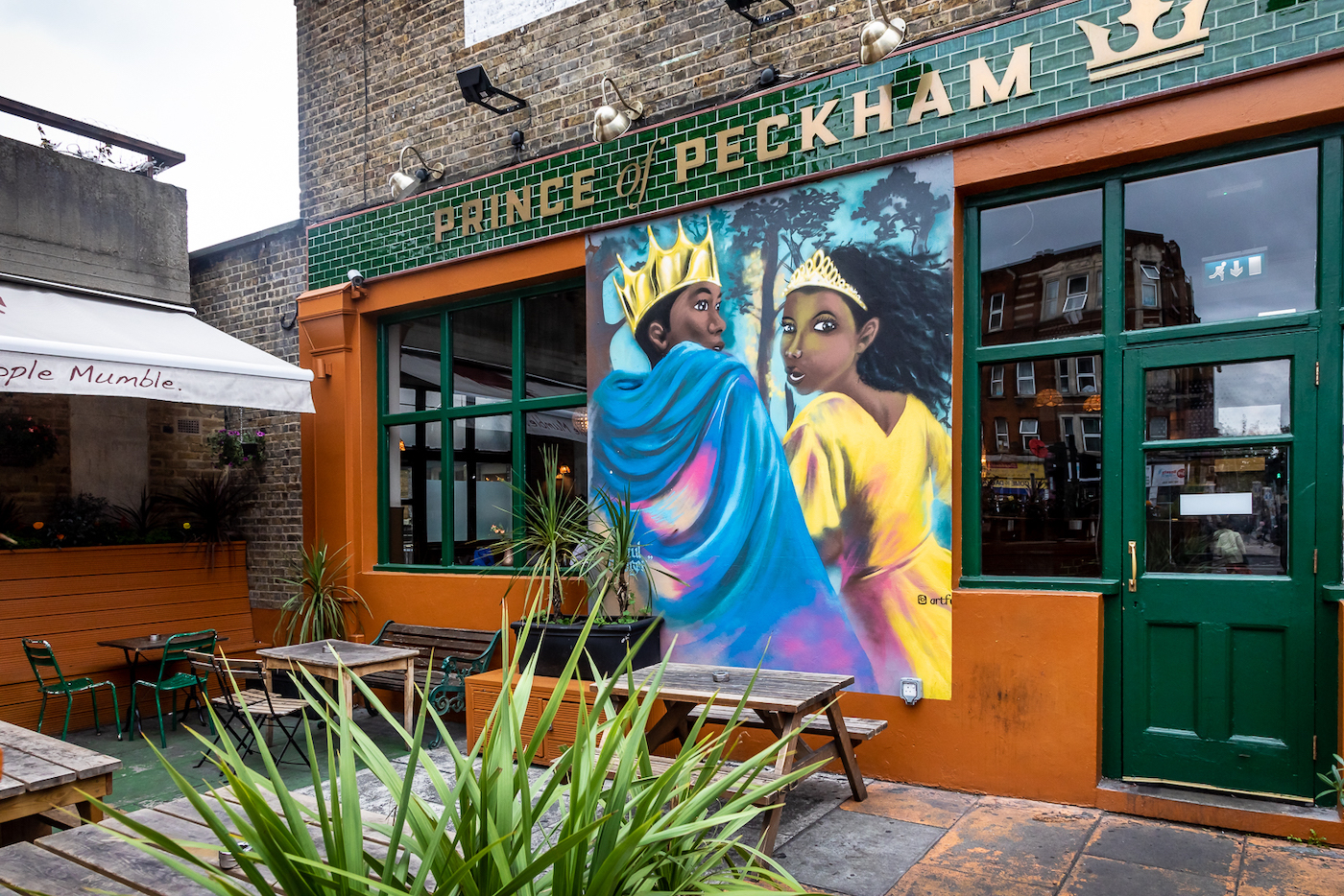 Vibrant mural on Yellow Room, Prince Of Peckham, ideal for events and gatherings.