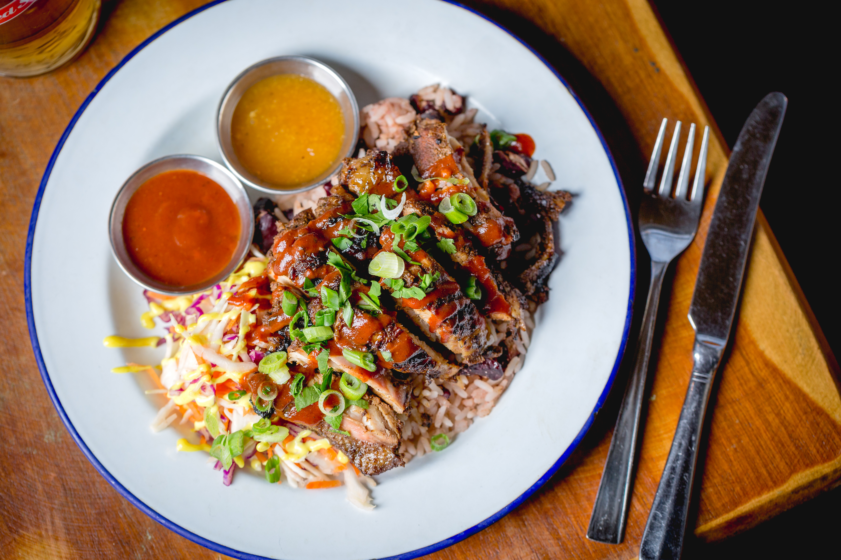 Grilled meat dish with rice and slaw at Prince Of Peckham event catering.