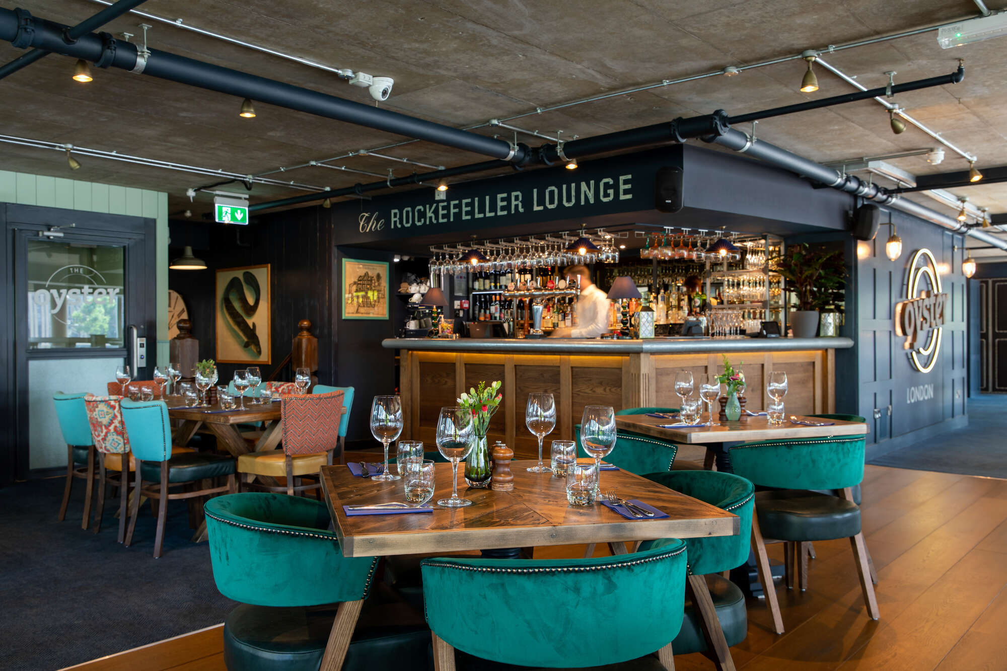 Rockefeller Lounge at The Oyster Shed: elegant bar, plush seating for networking events.