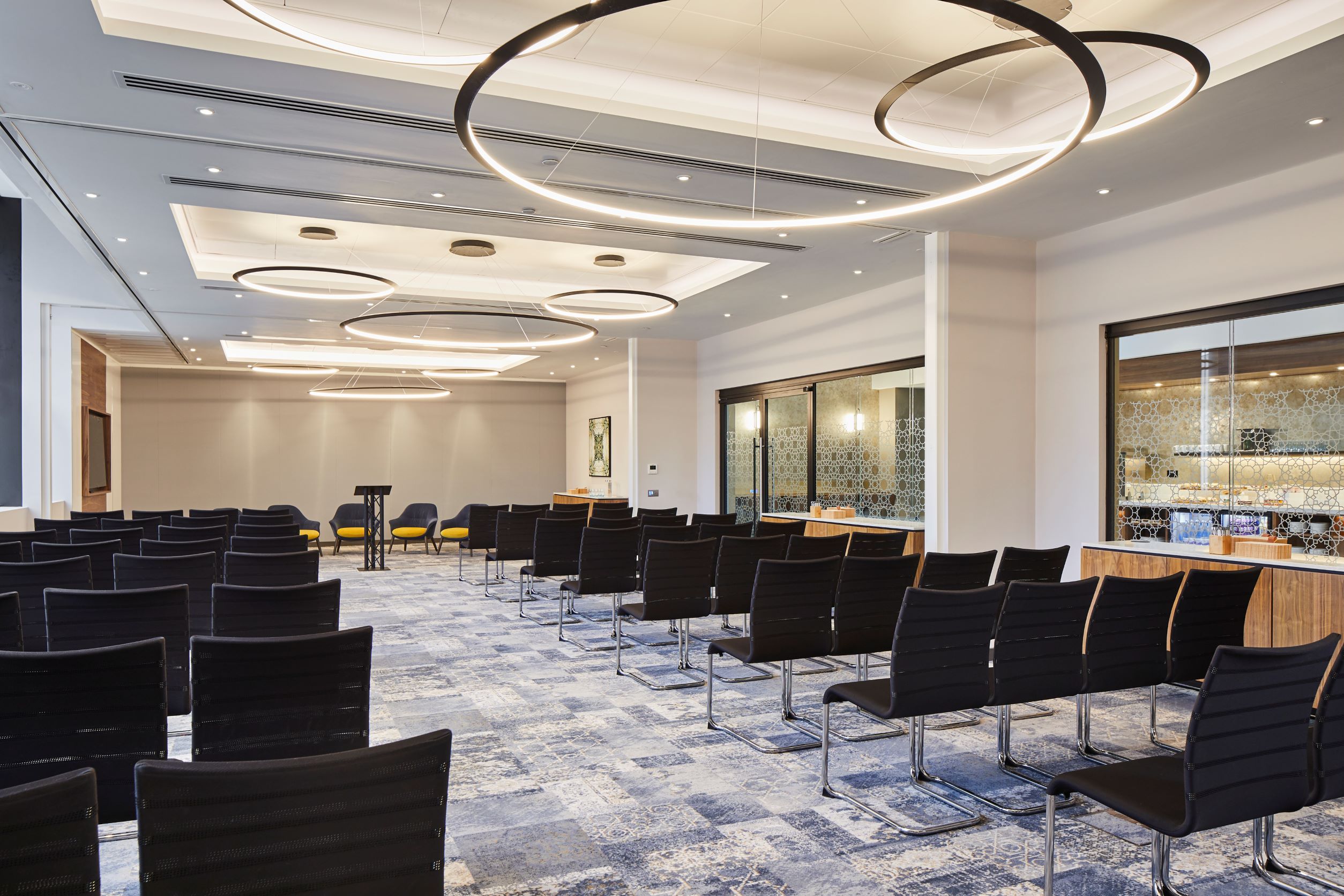 St. David's Suite at Cardiff Marriott: modern event space with sleek black chairs for workshops.