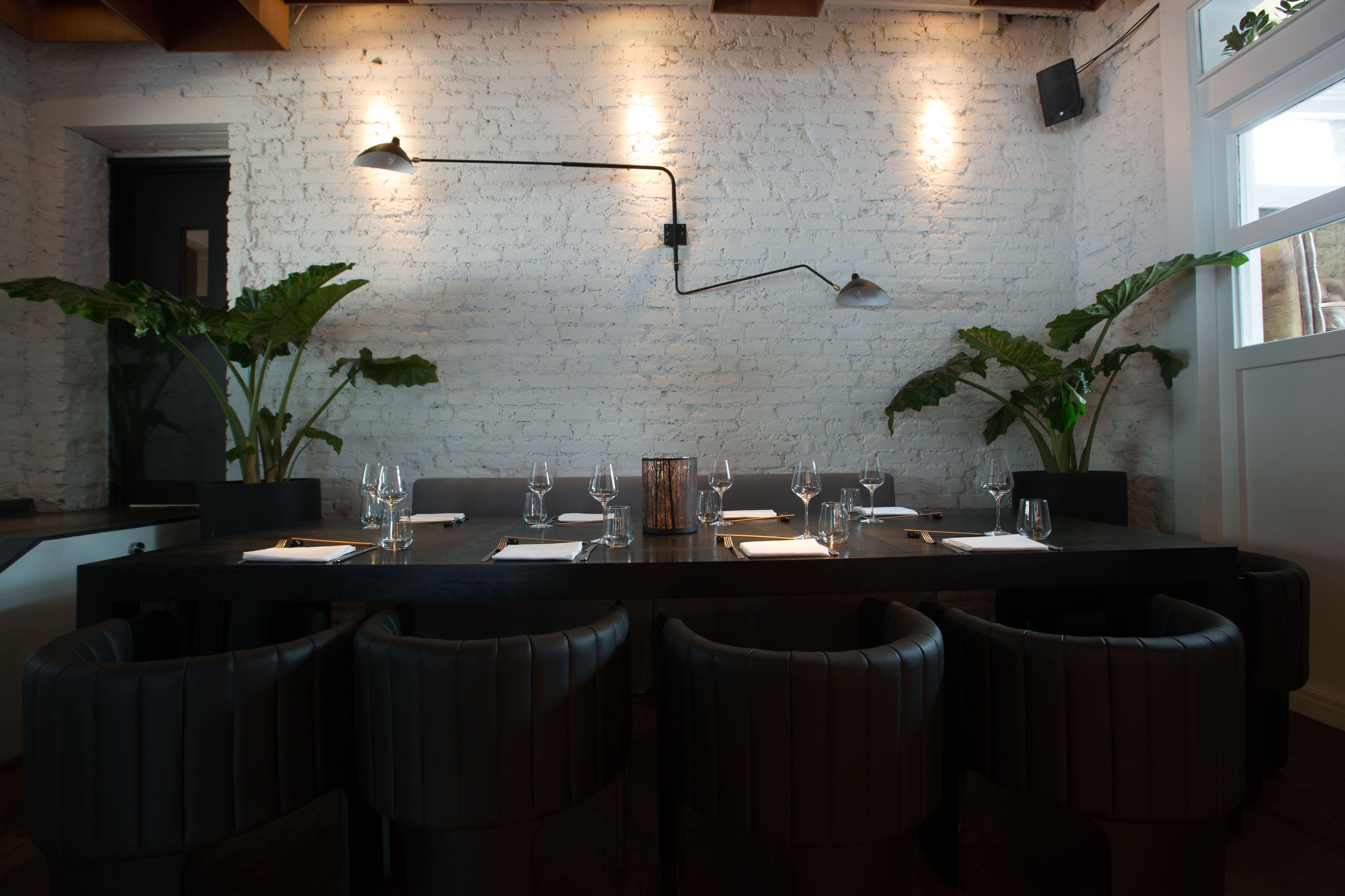 Robata Grill's modern meeting space with a large table, ideal for corporate events.