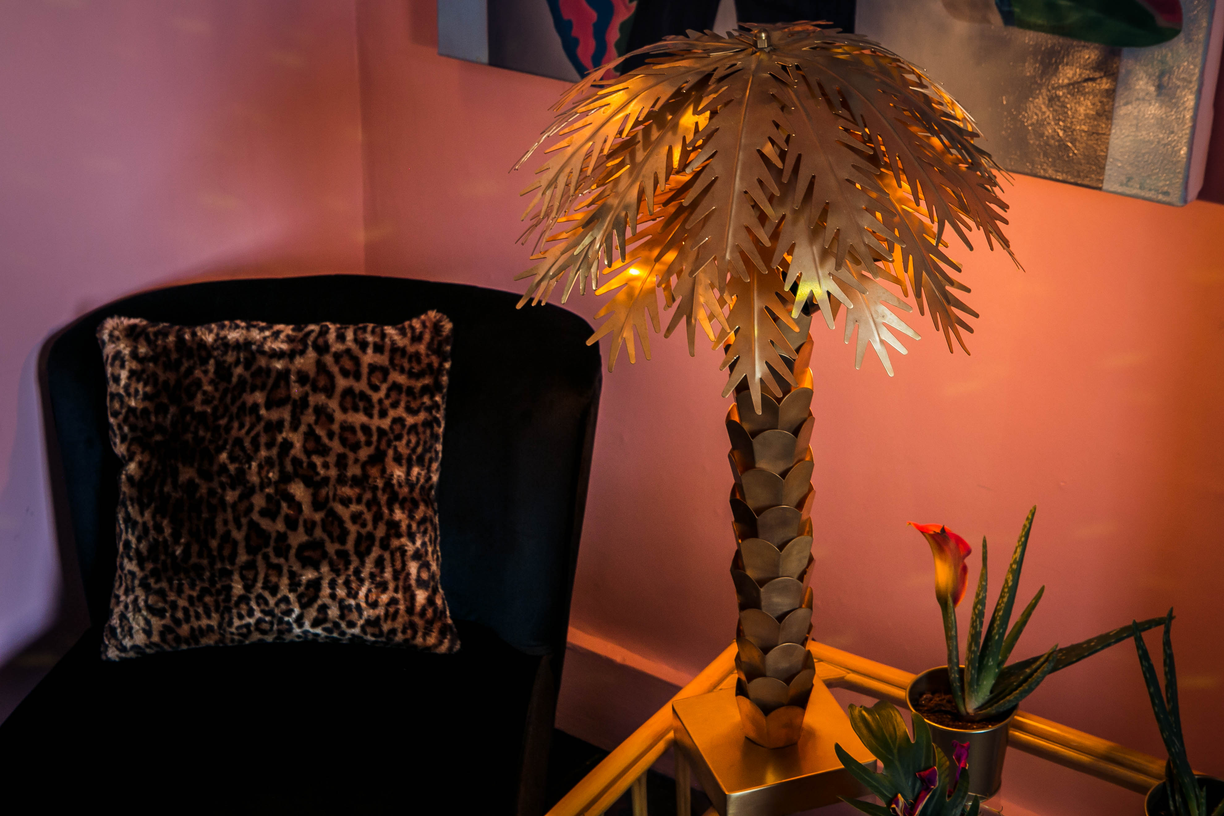 Tequila and Mezcal Parlour with palm tree lamp, ideal for networking events.