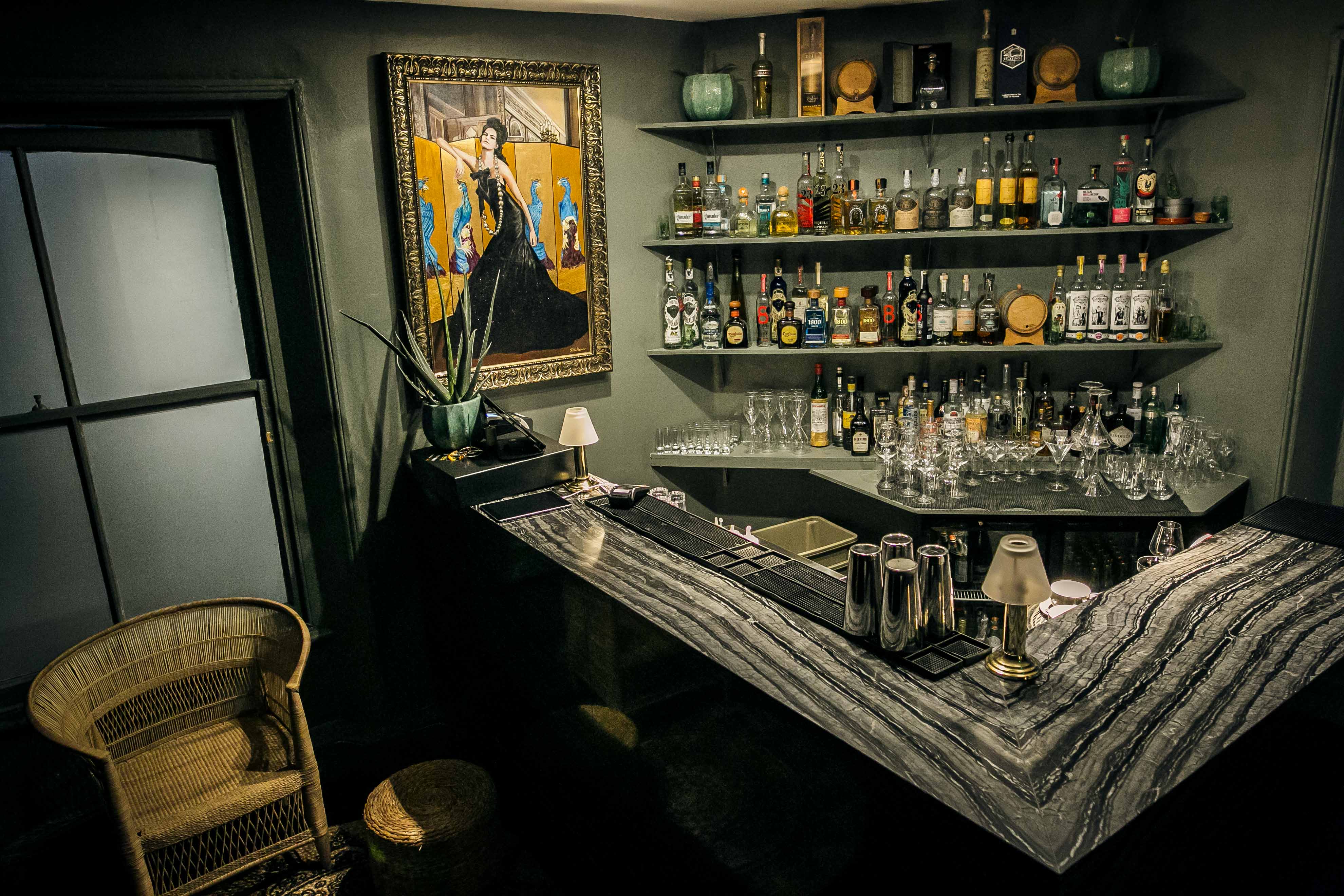 Stylish Tequila and Mezcal bar with marble counter, ideal for cocktail receptions.