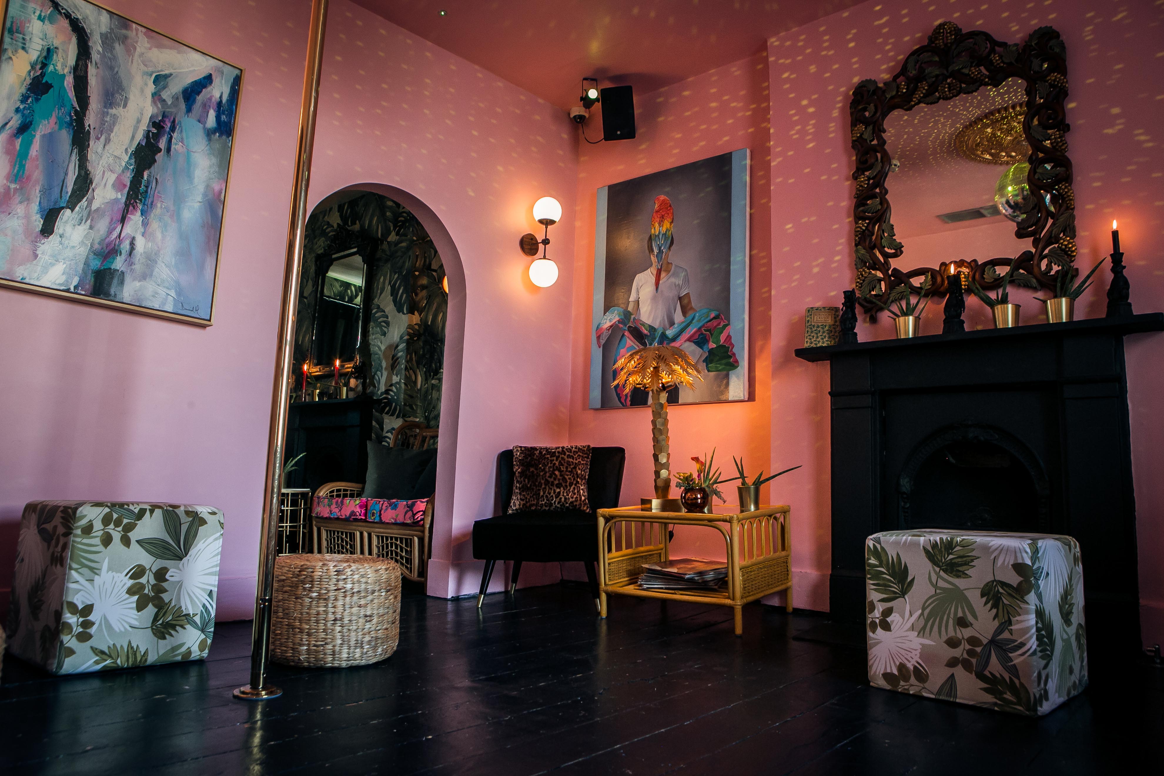 Vibrant Tequila and Mezcal Parlour with pink walls, ideal for networking events and workshops.