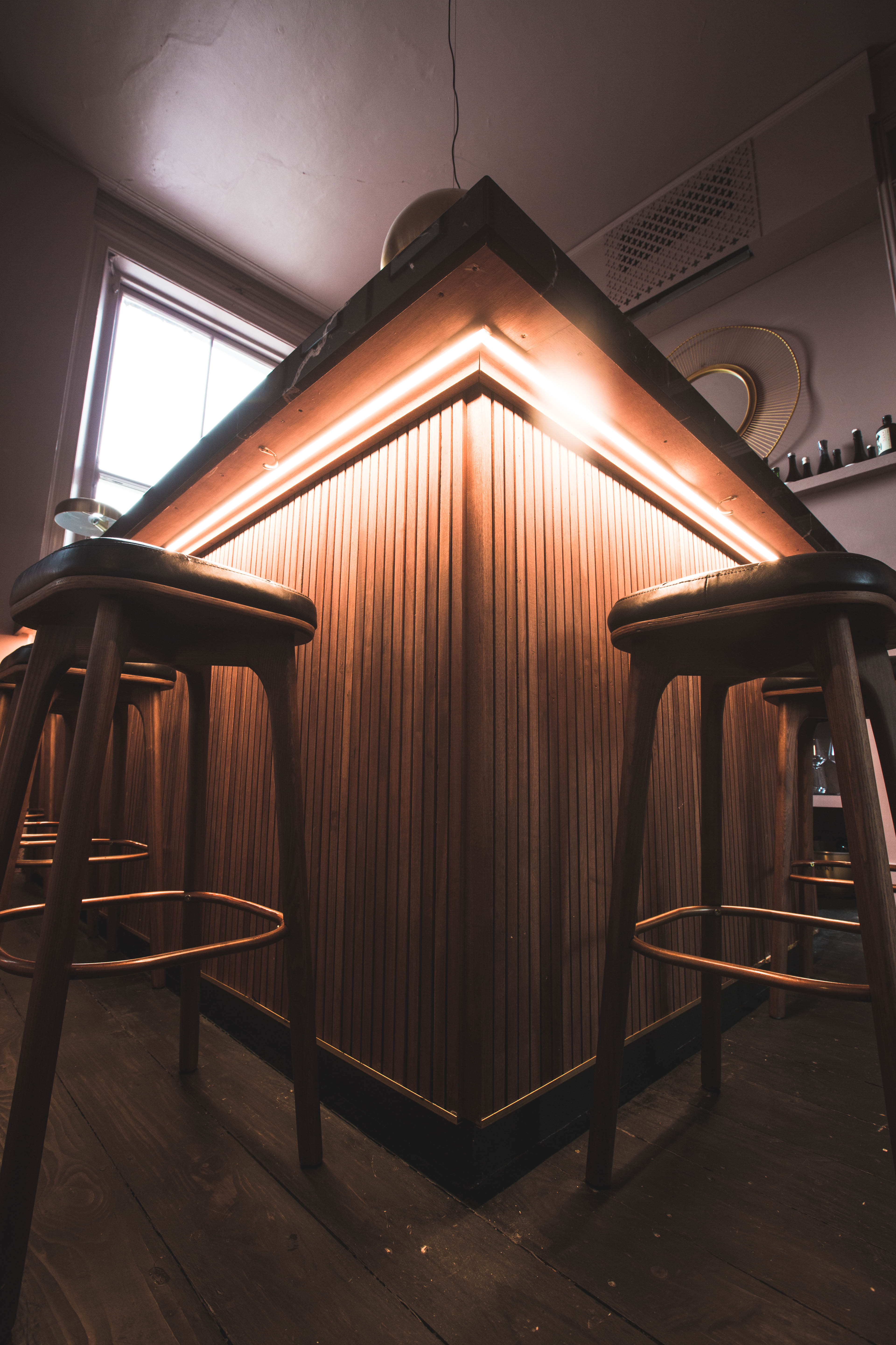 Stylish Whisky and Sake Bar with warm lighting, perfect for networking events.