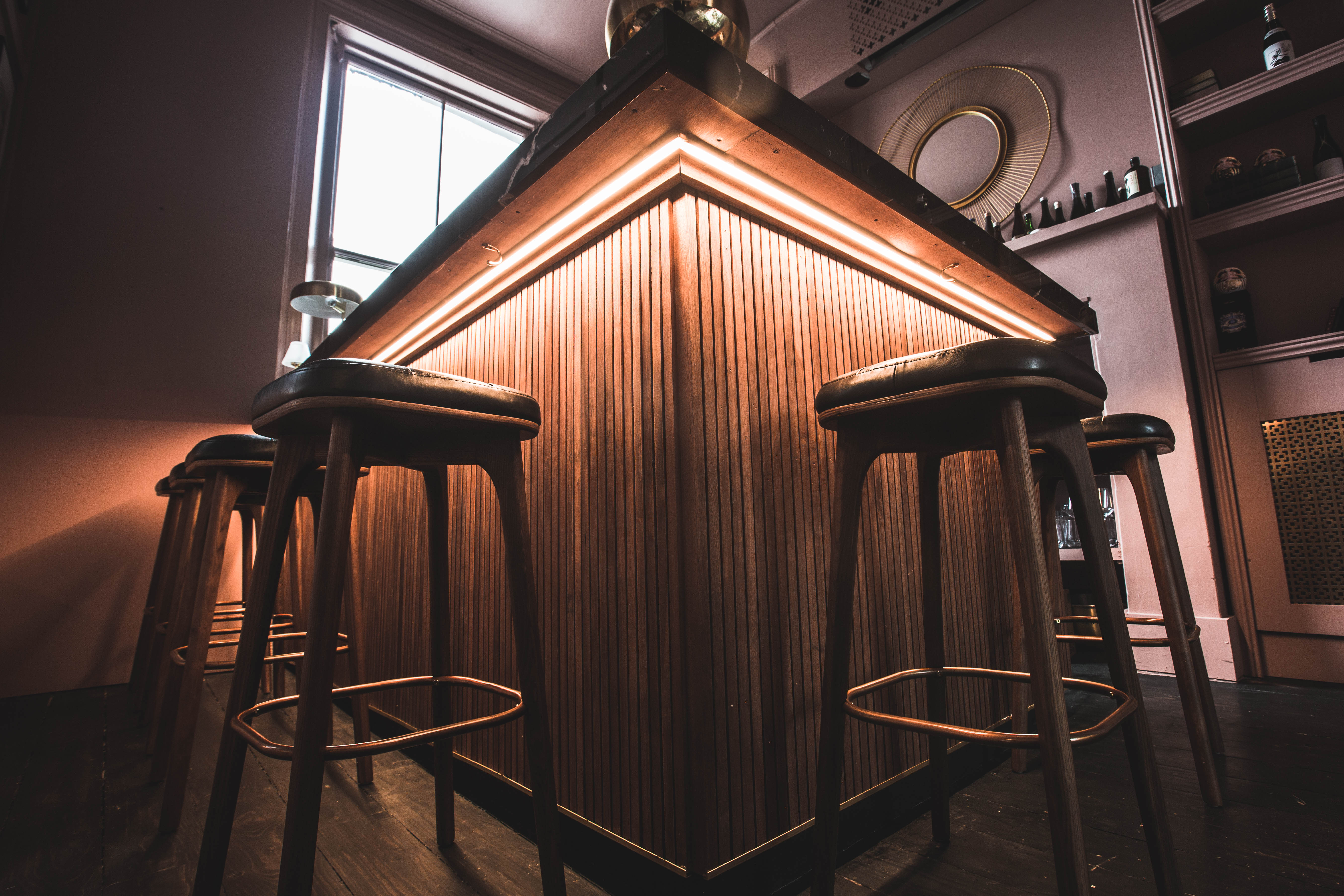 Stylish Whisky and Sake Bar with wooden counter, ideal for networking events.