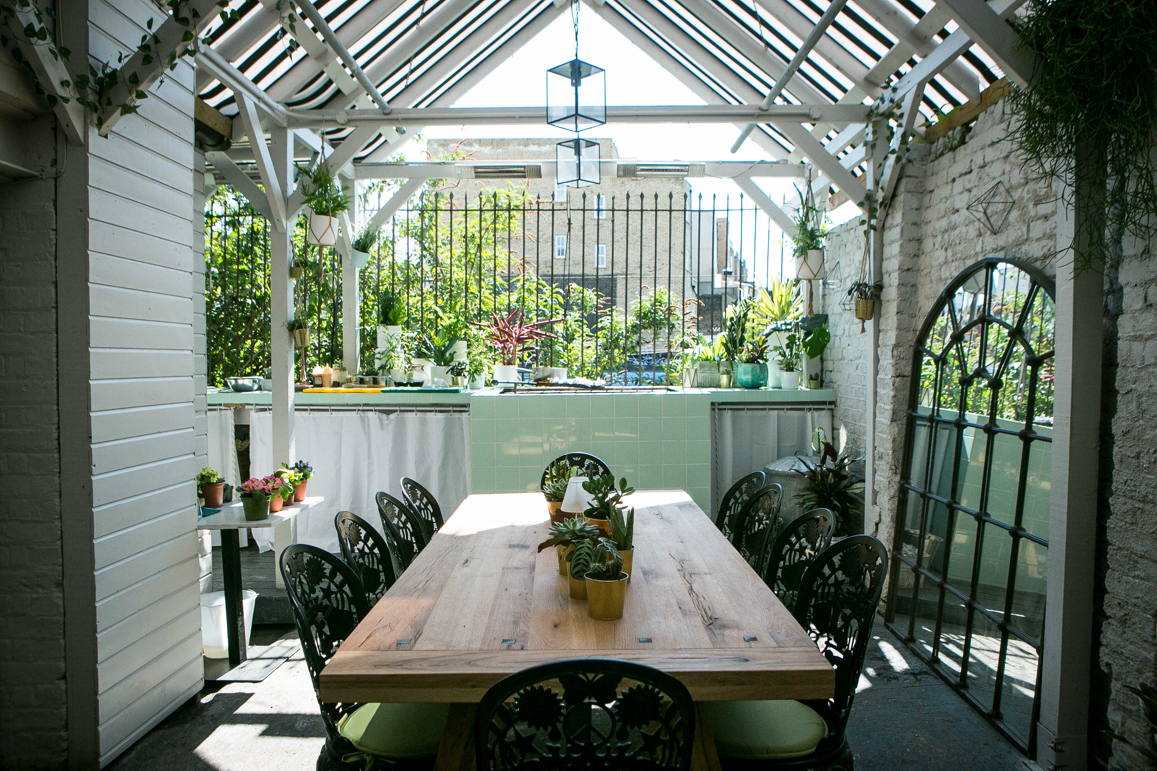 Al Fresco BBQ Garden with wooden table, ideal for meetings and gatherings in Southam Street.