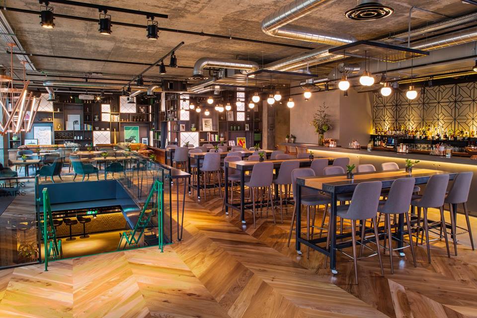 Modern event venue at Drake & Morgan Kings Cross with flexible seating and warm lighting.