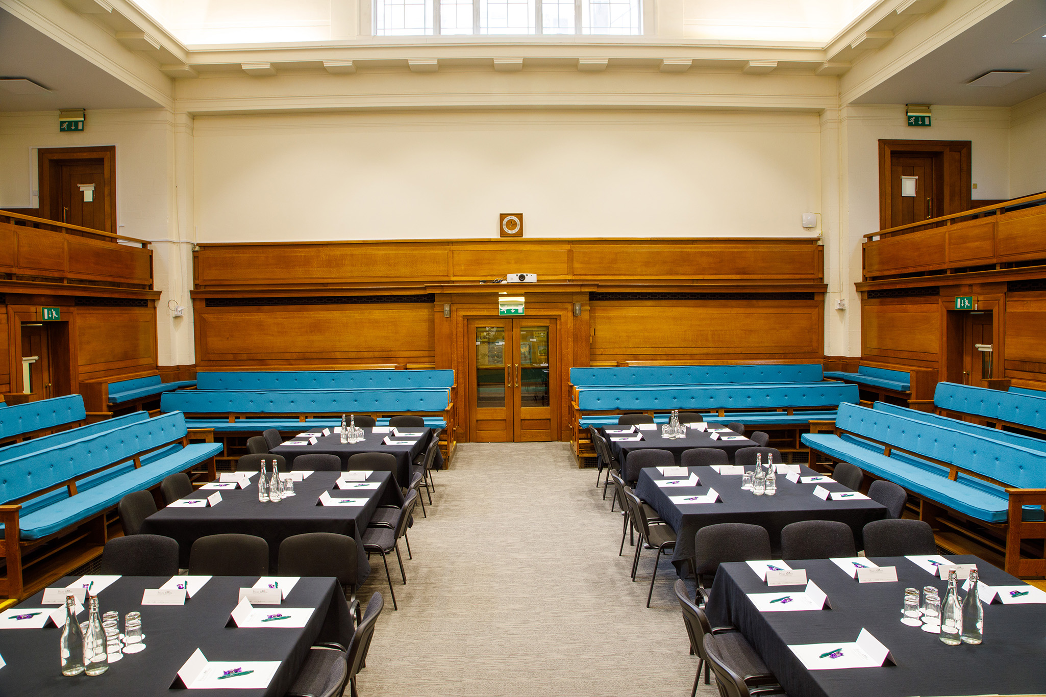 Main Meeting House with black tablecloths, ideal for meetings and conferences.