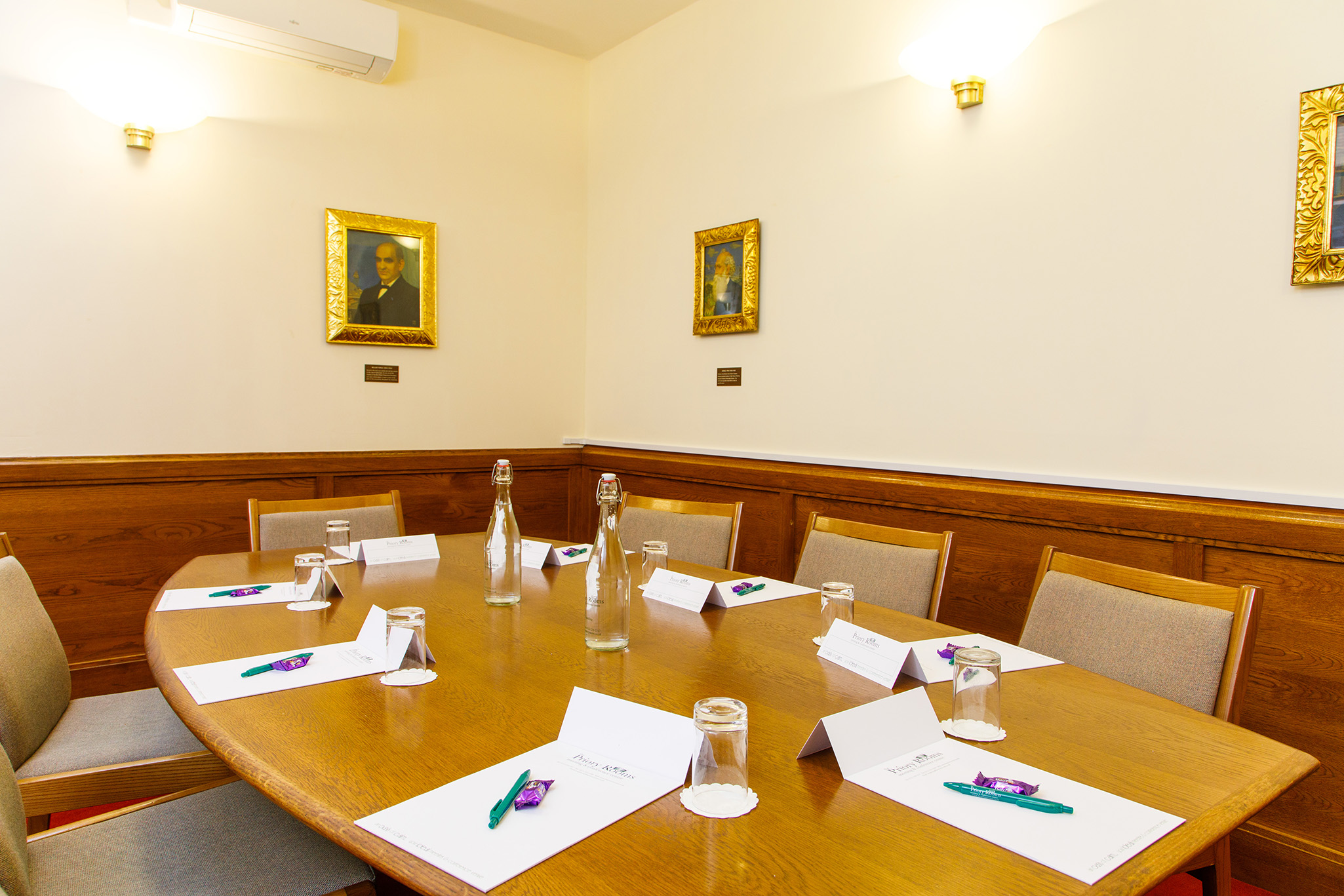Southall room at The Priory Rooms, polished table set for meetings, elegant decor.