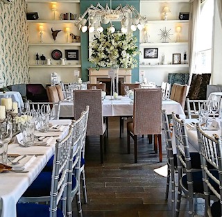 Elegant Private Room Blanchard with silver chiavari chairs for upscale events.