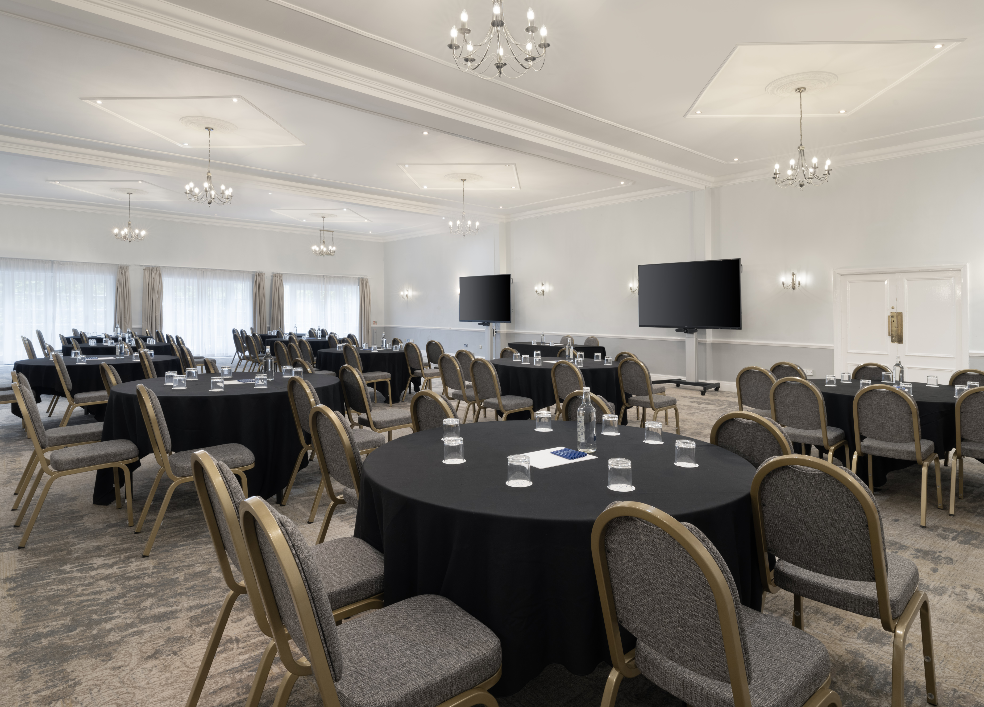 Broughton Suite meeting space with round tables, ideal for conferences and workshops.