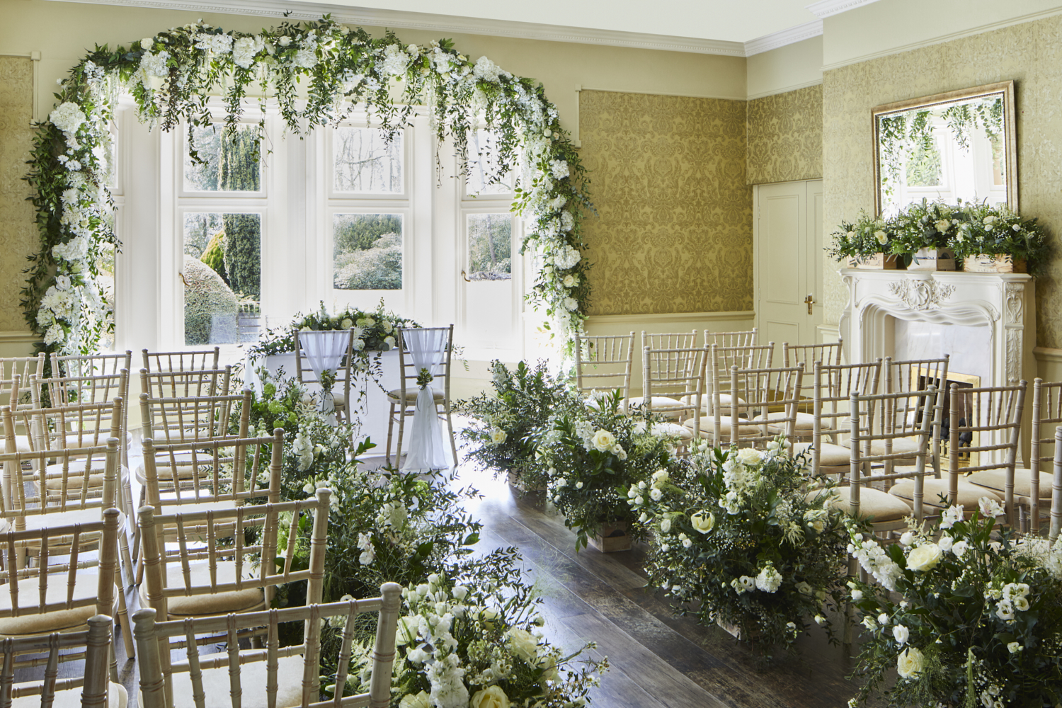 Elegant wedding ceremony space with floral archway at Delta Hotels Preston.