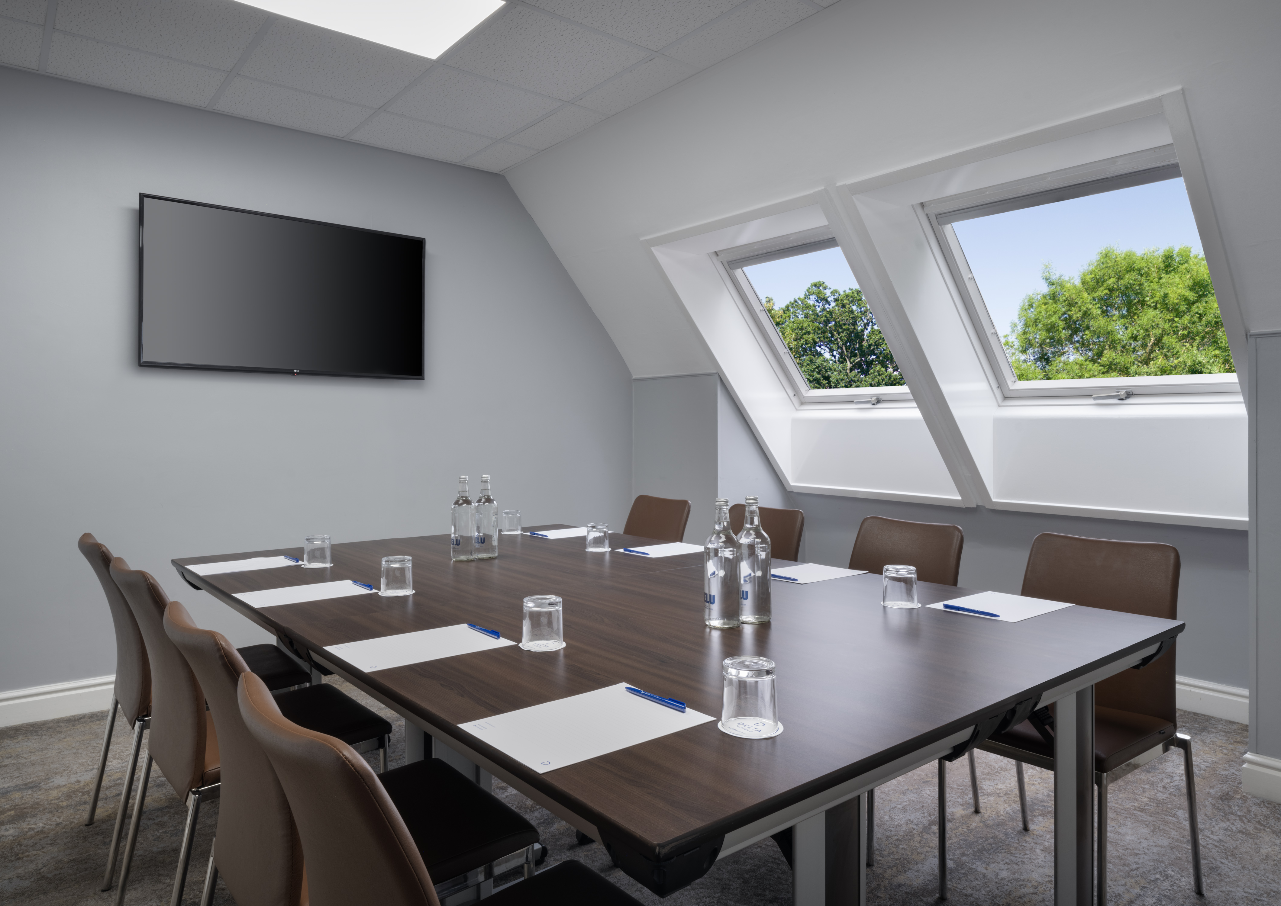 Modern meeting room at Delta Hotels Preston with large table for productive events.