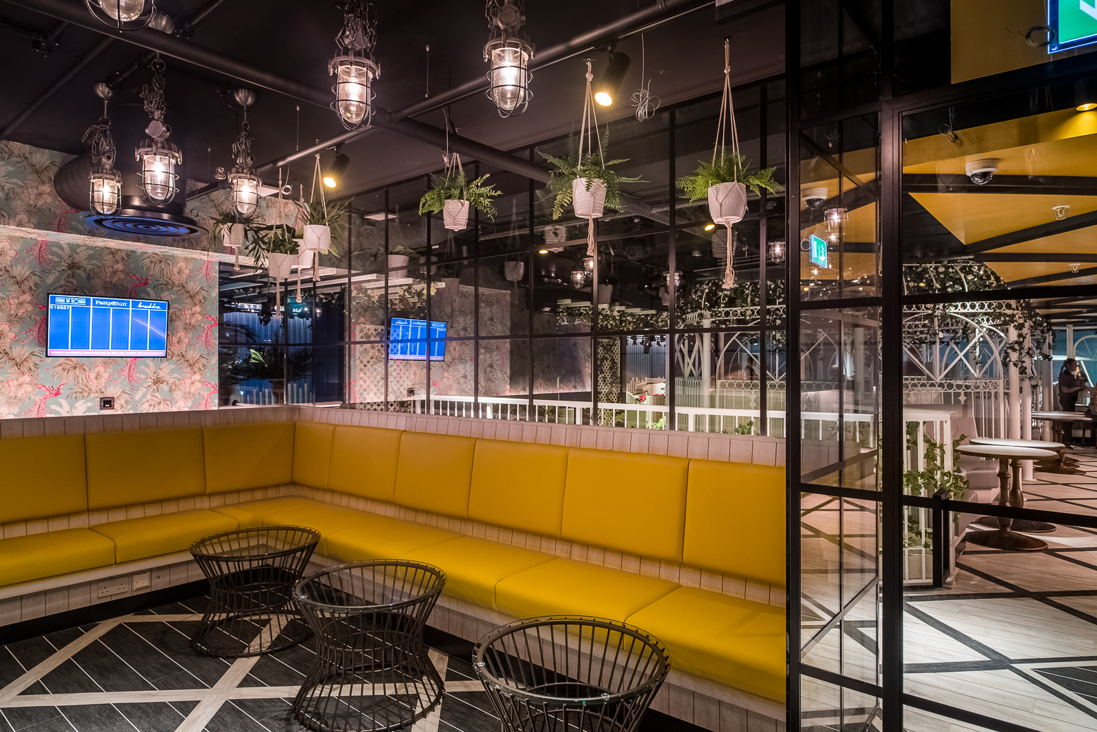 Modern Sun Room at Swingers West End with vibrant seating for events and networking.